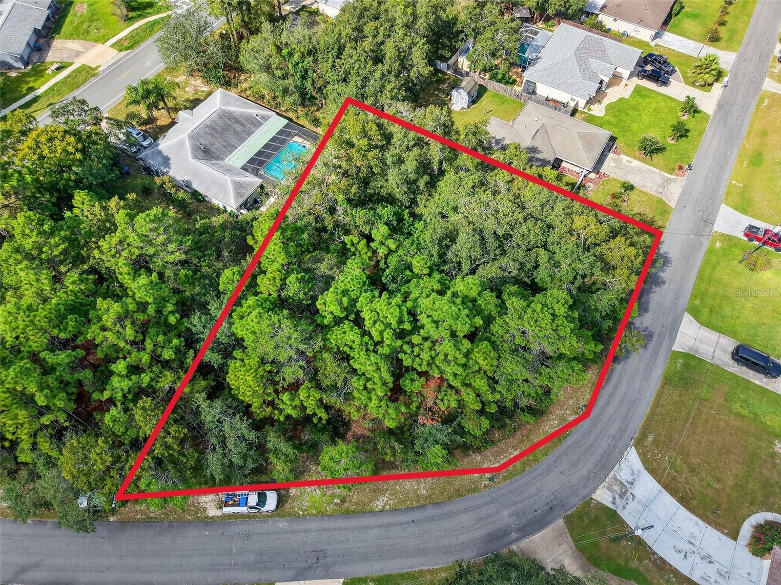 BUILD YOUR DREAM HOME on this spacious 0.40-acre CORNER lot located in the heart of Spring Hill, Florida! CORNER lots are great for those who desire to build with a side entrance garage! Situated in Spring Hill Unit 18, Block 1205, Lot 10 (Parcel #R32 323 17 5180 1205 0100), this OVERSIZED property offers the perfect opportunity to create your ideal Florida lifestyle. (LOCATED directly across from 11139 Gifford Drive) With NO FLOOD insurance required, no HOA, no CDD fees, and no deed restrictions, you’ll have the freedom to design and use your land your way! There’s plenty of ROOM FOR A CUSTOM HOME, a backyard pool, or even space to store your RV or boat! This CENTRALLY LOCATED lot is just minutes from everything—schools, shopping centers, restaurants, medical facilities, libraries, and county parks. You’ll LOVE BEING SO CLOSE to local favorites like Weeki Wachee Springs State Park (home of the world-famous live mermaid shows) Buccaneer Bay water park, and the CRYSTAL-CLEAR Weeki Wachee River, perfect for kayaking and paddleboarding. Enjoy the charm of nearby downtown Brooksville with its boutique shops, cafes, and small-town appeal, or take a quick drive to the Gulf of Mexico via nearby public boat ramps. Outdoor enthusiasts will appreciate the easy access to public golf courses, hiking and biking trails, nature preserves, and local marinas. PLUS you're just a short drive from Tampa, where you can enjoy professional sports, concerts, and the convenience of Tampa International Airport. Whether you're looking to build your forever home, a seasonal getaway, or an investment property, this lot has everything you need to make your vision a reality. Don’t miss out—experience all that Florida’s beautiful Nature Coast has to offer!