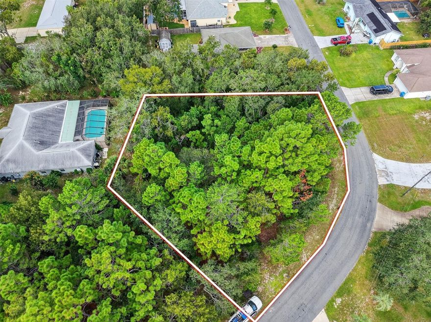 BUILD YOUR DREAM HOME on this spacious 0.40-acre CORNER lot located in the heart of Spring Hill, Florida! CORNER lots are great for those who desire to build with a side entrance garage! Situated in Spring Hill Unit 18, Block 1205, Lot 10 (Parcel #R32 323 17 5180 1205 0100), this OVERSIZED property offers the perfect opportunity to create your ideal Florida lifestyle. (LOCATED directly across from 11139 Gifford Drive) With NO FLOOD insurance required, no HOA, no CDD fees, and no deed restrictions, you’ll have the freedom to design and use your land your way! There’s plenty of ROOM FOR A CUSTOM HOME, a backyard pool, or even space to store your RV or boat! This CENTRALLY LOCATED lot is just minutes from everything—schools, shopping centers, restaurants, medical facilities, libraries, and county parks. You’ll LOVE BEING SO CLOSE to local favorites like Weeki Wachee Springs State Park (home of the world-famous live mermaid shows) Buccaneer Bay water park, and the CRYSTAL-CLEAR Weeki Wachee River, perfect for kayaking and paddleboarding. Enjoy the charm of nearby downtown Brooksville with its boutique shops, cafes, and small-town appeal, or take a quick drive to the Gulf of Mexico via nearby public boat ramps. Outdoor enthusiasts will appreciate the easy access to public golf courses, hiking and biking trails, nature preserves, and local marinas. PLUS you're just a short drive from Tampa, where you can enjoy professional sports, concerts, and the convenience of Tampa International Airport. Whether you're looking to build your forever home, a seasonal getaway, or an investment property, this lot has everything you need to make your vision a reality. Don’t miss out—experience all that Florida’s beautiful Nature Coast has to offer!