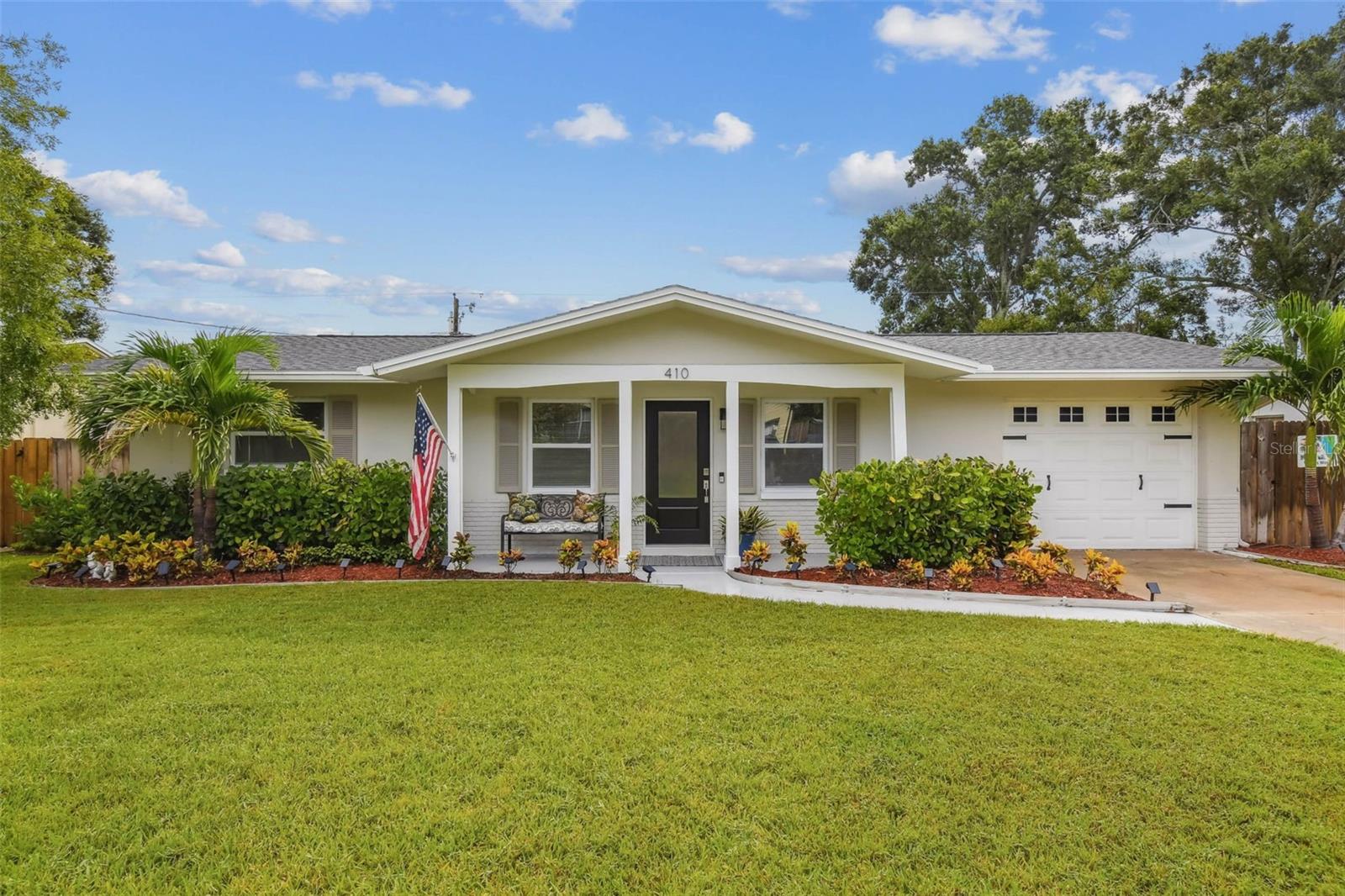 Absolutely move in ready! Everything is new or less than 3 years old. Roof 2025, Engineered hardwood floors 2025, Front door 2025, Windows in Family room 2025, AC, Water heater, extra insulation , appliances, kitchen and bath 2022. There's an outdoor shower and a small dipping pool for relaxing and cooling off in your private fenced-in backyard. There's also a screened-in back porch off of the Florida room, currently being used as an office. This room could be used as a dinning room, or family room or extra bedroom for guest. This home is bright and sunny with all updated windows. Garage is oversized. Landscaping is mature and on an irrigation system.
This is the perfect starter home with zero projects. Close to shopping, Largo Rec Center, Largo Park and Library and only 15 minutes to Sand Key beach.