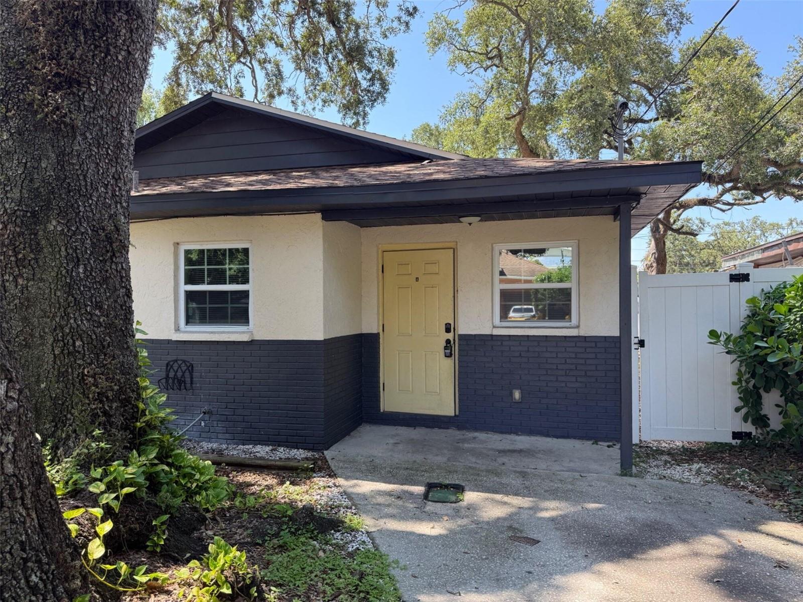 Beautifully updated 2BR/1BA Unit A in a quiet duplex setting, centrally located in Tampa. This home boasts fresh paint, modern vinyl plank flooring, and an updated kitchen with sleek cabinetry and counters. Both bedrooms feature ceiling fans and ample natural light. The bathroom is newly remodeled with clean finishes. Step outside to a fully fenced backyard—ideal for pets or relaxing evenings. Conveniently close to Ybor City, Downtown, major highways, and shopping. Pet friendly and professionally managed!