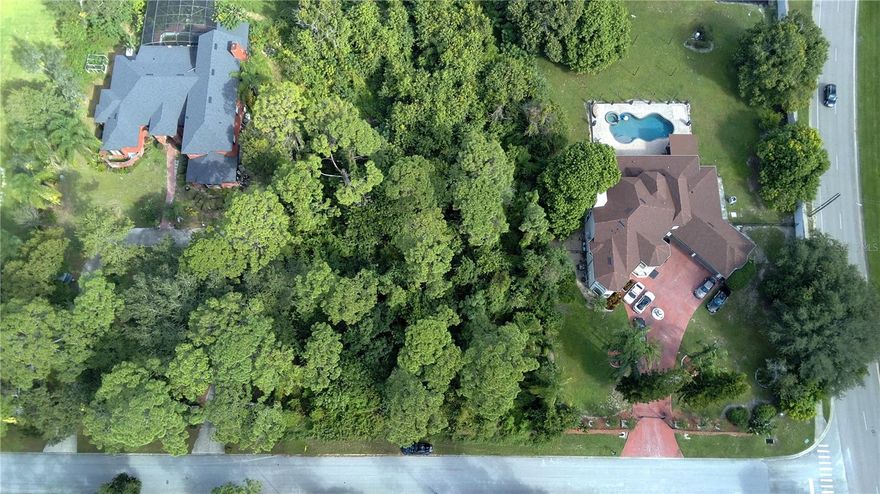 A rare opportunity to build your dream estate in one of Central Florida’s most coveted luxury corridors.
Nestled among multi-million-dollar homes in the highly sought-after Windermere Heights / Dr. Phillips area, this .96-acre buildable lot offers the perfect canvas for a custom residence that balances elegance, privacy, and convenience.
Located on a quiet, tree-lined street surrounded by established estate homes, this property combines natural beauty with exceptional accessibility — just minutes from the Butler Chain of Lakes, Bay Hill Golf Club, and Restaurant Row.
It’s a serene setting where every detail of your future home can reflect your vision, from a gated circular drive to a resort-style pool or detached guest casita. With nearly an acre of high, dry land and no HOA, you’ll enjoy architectural freedom and long-term value in one of Orlando’s most enduring luxury neighborhoods. Public utilities are nearby, and the lot’s rectangular shape allows for a wide range of design possibilities.