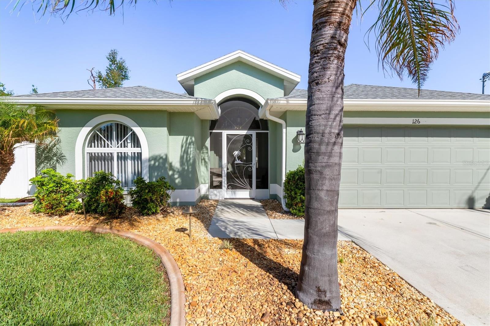 Find your own private paradise in this beautifully updated 3 bedroom, 2 bath pool home on a double lot in Rotonda West! A large screened porch welcomes you into the home, where you’ll immediately notice a direct view to the lanai and pool area. The living area leads to a beautiful kitchen, featuring ample storage space, stainless steel appliances, granite countertops, and a Kinetico water filtration/softener system w/reverse osmosis. The primary suite boasts a walk-in closet, extra linen closet, spa like walk-in shower, dual sinks with upgraded lighting, and direct access to the lanai. The garage is a standout with an epoxy coated floor and a convenient washtub. Outside is a true retreat perfect for year round enjoyment, with a heated saltwater pool with sunshelf, and a separate spa. Additional highlights include: RV/Boat parking with a separate 6” thick concrete pad, 50 amp electric hookup, fully fenced yard, and well-supplied irrigation. Conveniently located close to golf, marinas, beaches, restaurants, and shopping, this home seamlessly blends privacy, comfort, and functionality, making it the perfect place to create lasting memories. Lawn care, pool maintenance, and HOA fees included in rent. Available to rent now!