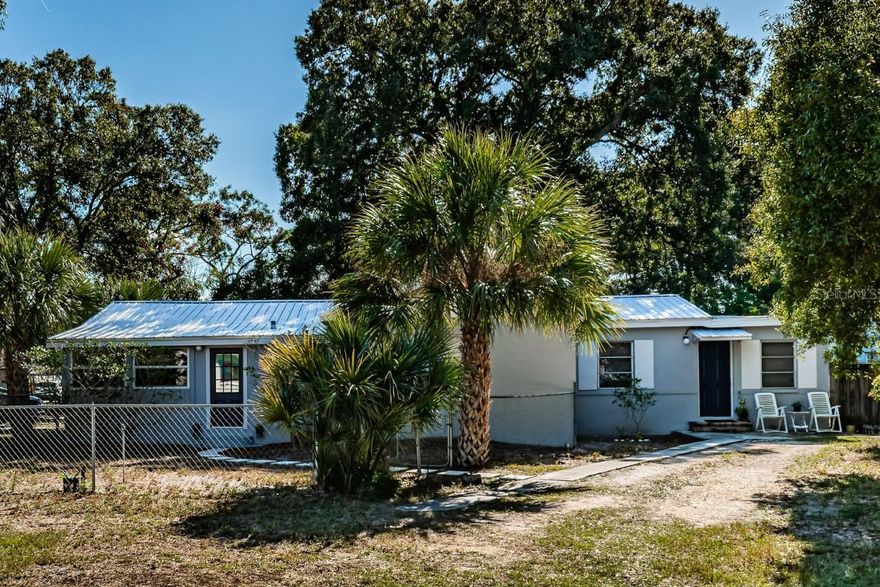AN AMAZING DUPLEX AND EXCEPTIONAL INVESTMENT OPPORTUNITY IN ST. PETERSBURG WITH AIRBNB POTENTIAL! Situated on a corner lot, located in Unincorporated Pinellas County, NO HOA & NOT IN A FLOOD ZONE, this gem is a savvy income property awaiting its next owner! Unit A welcomes you with a spacious 3-bedroom, 2-bathroom layout, providing ample living space for residents. Meanwhile, Unit B is a cozy 1-bedroom, 1-bathroom unit with its own kitchenette – a perfect setup for potential rental income or a multi-generational living arrangement.
Each unit has its own utility meter, mailbox and separate entrance, providing privacy and convenience for both occupants. This unique layout allows for various income-generating possibilities, including renting out both units, utilizing them as Airbnb accommodations, or living in one unit while renting out the other. The choice is yours. Additionally, there's no shortage of outdoor space, Enjoy the screened-in porch with separate patios for each unit, perfect for enjoying the Florida sunshine. 
Metal roof (aluminum) installed in 2019. Central AC in main house, 2 wall units in Unit B. Recent upgrades include fresh paint inside and out, vinyl flooring, granite countertops, backsplash tile, and remodeled bathroom. Bedroom #3 has portable wardrobe. Property is completely fenced. Conveniently located near shopping, restaurants, beaches, the airport, and more. Schedule your showing today and discover the endless possibilities that await in this St. Petersburg gem!