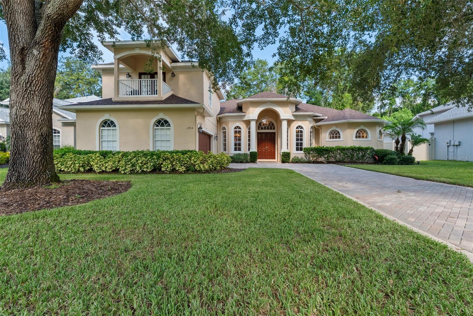 Location, layout and an elevated Florida lifestyle. If this is your dream, welcome home! Tucked within Highland Oaks Preserve, a quiet, gated community of only 36 homes with NO CDD fee, and NO FLOOD ZONE REQUIREMENT. Step inside to discover a bright, open layout within nearly 3,000 square feet of interior living space. A wall of glass doors opens onto the covered lanai and screened pool area to further expand the living experience. The heart of the home is the gourmet kitchen, featuring wood-look tile flooring, granite countertops, stainless steel appliances a center prep island and full pantry. The 42” overhead cabinets are trimmed with crown molding. A cozy seating area is the perfect space for guests to relax and chat while your inner Martha Stewart takes over. If you prefer a more formal setting, the dining room will easily accommodate a 10-12 person table. Thoughtful design is evident as all common rooms overlook the screened, saltwater pool and outdoor living area in a way it feels as if the home hugs the outdoor space, lending a level of privacy not commonly found. All areas within the home flow seamlessly into one another—ideal for entertaining or relaxed everyday living. Whether you work remotely or just need a space to close the 8 foot double doors and call your own, look no further as this home offers a perfect space for a home office, craft room or playroom. The primary suite has a recessed private entry leading to a bedroom area large enough for seating and relaxation in addition to a king bed. The ensuite bathroom is a WOW with two sided walk-in entry with dual showers. The centrally placed soaking bathtub separates two sink and vanity areas with plentiful counter and cabinet space. Did we mention the closets are custom designed by California Closets? The split floor plan with two additional downstairs bedrooms and full bath allow for privacy for all. The second level of the home is a spacious 17’x14’ ensuite perfect for extended guests, or returning college student, complete with a private bath, walk-in closet and Juliet balcony. The laundry room includes a front load washer and dryer and is conveniently located at the interior entry from the garage. Additional amenities of the home include a paver driveway leading to a side entry oversized 2 car garage, central vacuum, zoned irrigation, 5 ton HVAC replaced in 2020. Convenient to I-75, and minutes from Tampa Premium Outlets offering top brand shopping, dining and events. Downtown Tampa is 35 minutes for sporting events, arts and entertainment in addition to Tampa International Airport. Homes within Highland Oaks Preserve historically sell quickly with this being the only home currently available. We look forward to seeing you!