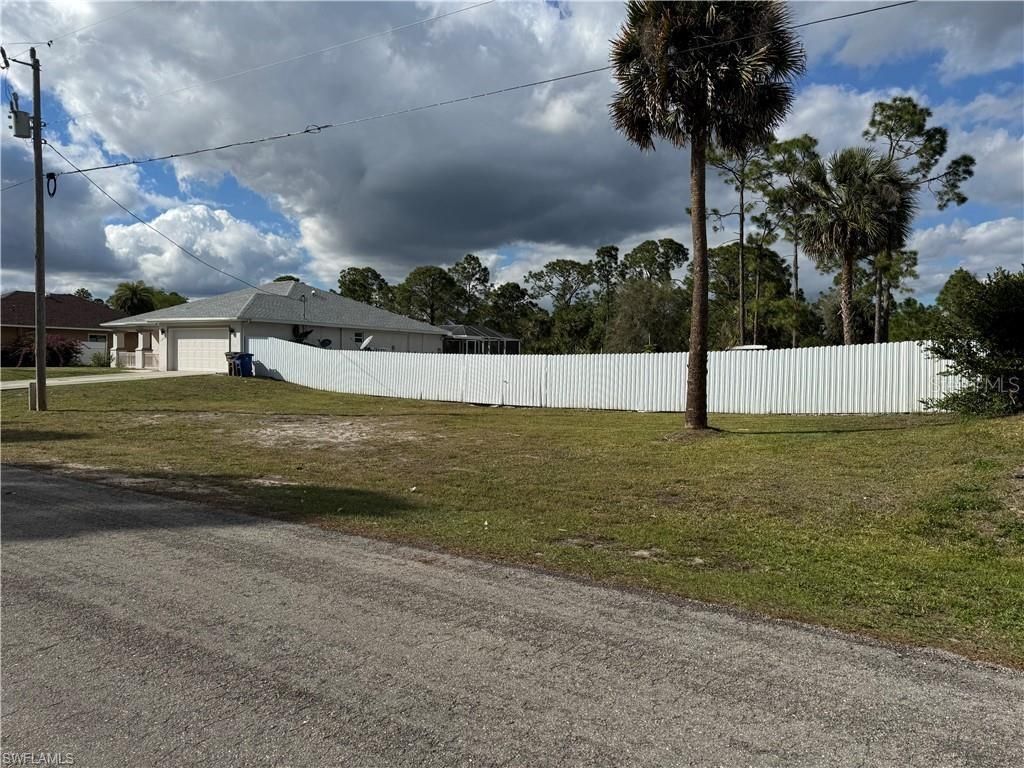 Photo of 1065 Lilac Street E, Lehigh Acres, FL 33974 (MLS # A4648894)