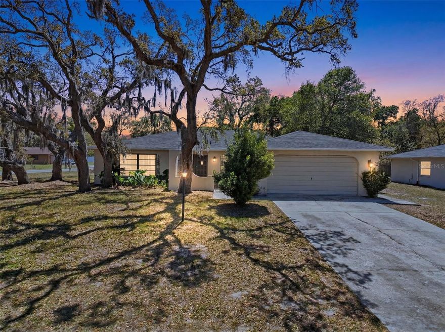 Beautiful 2-bedroom, 2-bath, 2-car garage home on a desirable corner lot featuring a new roof and updated bathrooms. Centrally located near shopping, dining, and everyday amenities. A charming walkway with mature landscaping leads to double entry doors. Inside, enjoy tile and laminate flooring, ceiling fans, and a step-down family room filled with natural light—perfect for entertaining. The kitchen offers a breakfast bar, dining area, and essential appliances. Sliding doors open to a screened-in patio, ideal for outdoor gatherings. The spacious primary suite includes a walk-in closet and calming neutral tones. Make an appointment today and come see your future home!