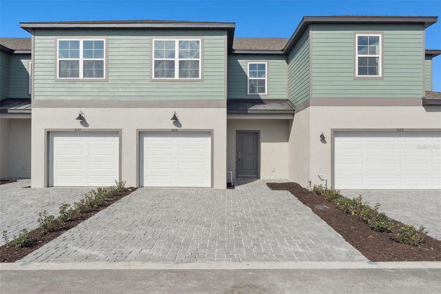 MOVE IN READY! If you’re looking for a home that gives you real value and a strong sense of community, this is the kind of place that truly fits your lifestyle—just minutes from Downtown Eustis and Mount Dora with an unbeatable mix of convenience and affordability. This stunning townhome offers 1,657 sq. ft. of thoughtfully designed living space, featuring 3 bedrooms, 2.5 bathrooms, and a spacious loft ideal for work or relaxation. Step inside from the covered porch and enjoy an airy, open-concept layout enhanced by white cabinets throughout, sleek tile flooring on the first floor, and impressive 9'4" ceilings. The modern kitchen showcases quartz countertops, stainless steel appliances, and flows seamlessly into the great room and dining area—perfect for entertaining. Sliding glass doors open to a generous covered lanai, extending your living space outdoors. Upstairs, the primary suite offers a private bath and walk-in closet, while two secondary bedrooms share a full bath. With a 1-car garage and 2-car driveway, and HOA-covered lawn maintenance, this beautifully crafted townhome delivers effortless, low-maintenance living in an exceptional location. The community also features a dog park and a playground, providing great outdoor spaces for pets, families, and residents to enjoy. Plus, you’ll be just minutes from the best local attractions—from Mount Dora’s scenic boat tours, boutique shopping, art galleries, and lively festivals, to Eustis favorites like Ferran Park, Trout Lake Nature Center, Lake Eustis for kayaking, and performances at the Bay Street Theater. And with easy access to Apopka and Ocoee, you’re perfectly positioned near major shopping, dining, commuter routes, and employment hubs. This location offers the ideal blend of comfort, convenience, and endless things to enjoy. DISCLAIMER: Photos and/or drawings of homes may show upgraded landscaping, elevations and optional features that may not represent the lowest priced homes in the community. Pricing, Incentives and Promotions are subject to change at anytime. Promotions cannot be combined with any other offer. Ask the Sales and Marketing Representative for details on promotions. All photos are stock photos of the floorplan.