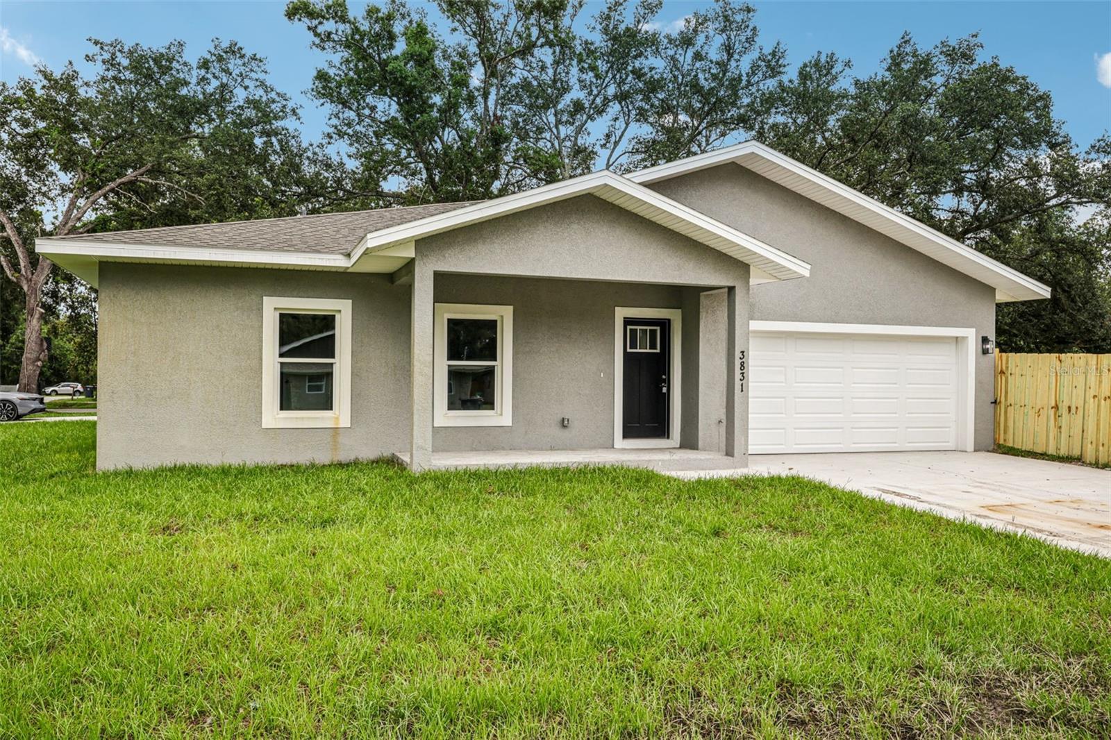 A brand-new, never-lived-in home located in a quiet residential area of Tampa. This beautiful 3-bedroom, 2-bathroom and a spacious 2-car garage offers the perfect combination of modern design, comfort, and convenience. As you step inside, you’ll immediately notice the open-concept floor plan filled with natural light, luxury vinyl plank flooring throughout the main living areas, and plush carpet in the bedrooms. The kitchen is a standout feature with sleek cabinetry, quartz countertops, stainless steel appliances, a large center island with bar seating, and a roomy pantry—perfect for both everyday living and entertaining. The split-bedroom layout offers privacy and functionality. The primary suite features a generous walk-in closet and a private en-suite bath with dual sinks and a walk-in shower. On the opposite side of the home, two additional bedrooms and a full guest bathroom provide flexibility for guests, family, or a home office. Additional highlights include full-size washer and dryer hookups, energy-efficient windows and HVAC, and a covered patio ideal for relaxing outdoors. A fenced backyard is perfect for pets. Conveniently located near I-4, I-75, and US-301, this home offers easy access to Downtown Tampa, Brandon, Ybor City, the Seminole Hard Rock Casino, Amazon’s fulfillment center, and many other major employers and attractions. You’ll enjoy being close to shopping, dining, and entertainment while still coming home to a peaceful neighborhood. Available for immediate move-in, this is your chance to be the very first resident of this brand-new construction home. Don’t miss out—schedule your private showing today!