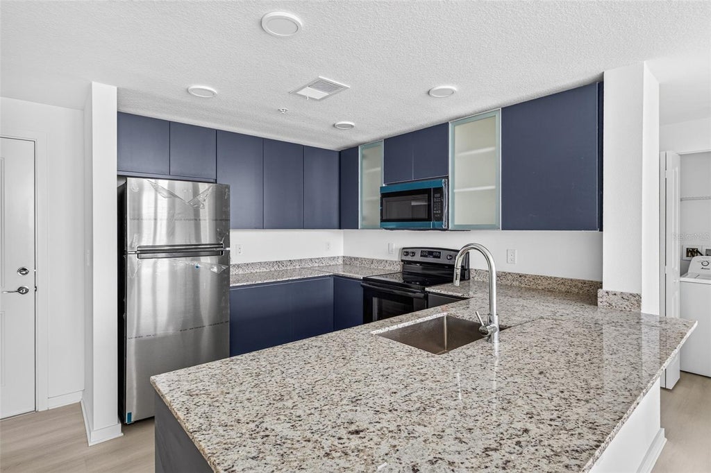 Photo of 5563 Millenia Park Blvd #417, Orlando, FL 32839 (MLS # O6446323)