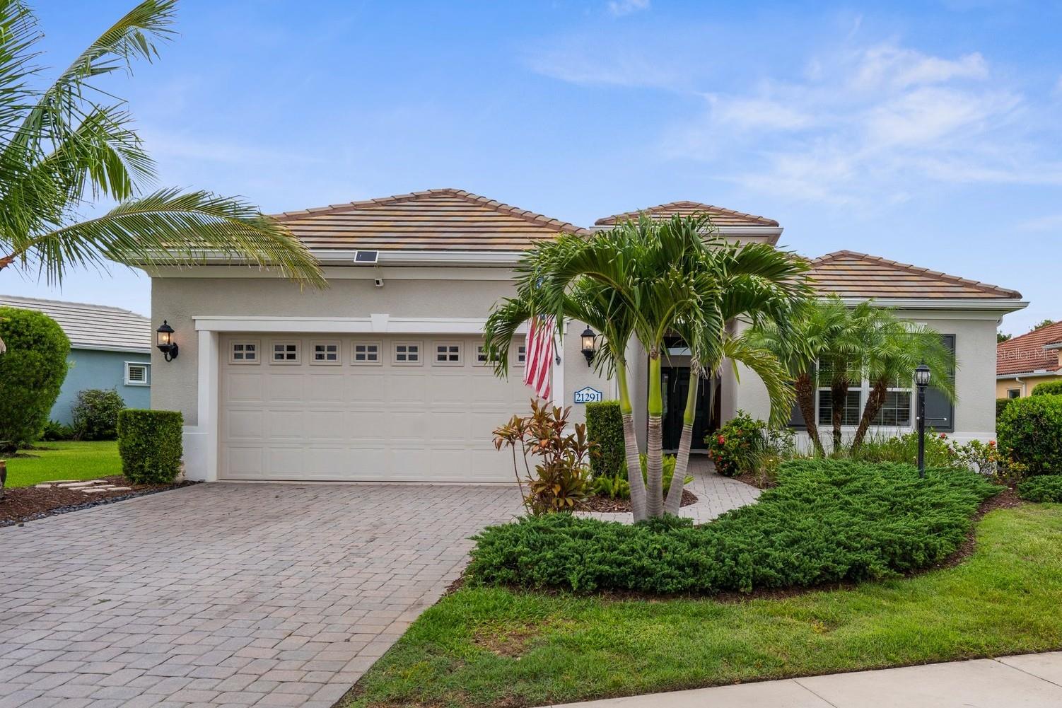 This is The One! Your beautifully upgraded 3-bedroom, 2-bathroom home with spacious den located in “The Cove” maintenance-assisted area of Grand Palm. Situated on a wedge-shaped oversized lot, this is not to miss! Over the past 7 years, nearly every aspect of this home has been updated (interior paint most recent). The Kitchen went through a complete renovation in 2023- Cambria quartz countertops, subway tile backsplash, over and under cabinet lighting, smart appliances to include a double induction oven with an air fry setting—ideal for the modern cook. The Kitchen is centrally located and flows into several inviting living spaces: a Living area, with a custom-built feature wall designed for your tv and media needs; a comfortable Sitting room/Library with custom cabinetry and a fireplace; a Dinette ideal for entertaining. In addition to the Primary suite and two Guest Bedrooms is a Den with French doors for an Office/Music room or additional room for guests. Throughout, you will see 10-foot and tray ceilings and new water- and scratch-resistant wood laminate and tile flooring.
This part of Grand Palm is hidden and quiet, perfect for your own private backyard living space. The spectacular heated natural gas chlorine pool with a tranquil waterfall awaits. Surrounded by new paver decking and lush Eureka palms for added privacy, the screened-in lanai is prewired for an outdoor TV and speaker system, creating the perfect area to relax or entertain while overlooking a peaceful nature preserve. Ahhh The Sunsets! The home also includes a 30 amp plug for an RV, hurricane panels, an in-wall pest control system, and plenty of functional upgrades. You won’t believe the height in the extended garage which features overhead storage and a workbench.
Grand Palm is an amenity-rich and nature-focused community within Wellen Park. You will have access to many nature trails and parks (take a walk around Adventure Lake with a stop to observe nature on Lookout Point Island), fitness center, three community pools (one with a waterslide), courts for bocce, tennis, pickleball, volleyball, basketball. The Grand Palm Social Club hosts a variety of monthly activities to ensure you will never be bored. The Cove, about 80 homes, has exclusivity to their own neighborhood pool as well! Explore downtown Wellen Park with a variety of shops and restaurants to explore in addition to Publix, banking, hardware and convenience stores. Downtown Venice and a plethora of beaches are within a 20 minute drive. Interstate 75 for easy access to 4 different airports to pick up your guests and family! They are going to love it here!