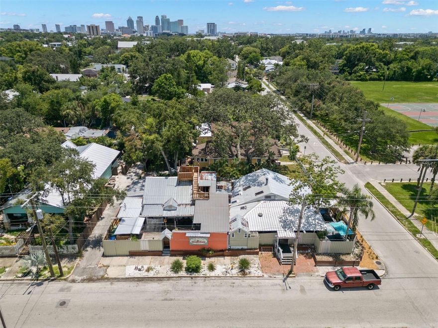 This is Your Opportunity to Own a Piece of History!Income Producing B&B/ HOSTEL
Gram's Place Bed and Hostel is Tampa's oldest Hostel. 
Gram's Place Bed and Hostel features 6 completely private rooms with ensuite baths, 6 traditional shared dorm rooms with shared baths, 2 'Semi-Private” Rooms which are still private, but without an ensuite bath, and multiple common areas as well as an outdoor ½ bath and shower. 
All rooms are air conditioned, and the property has full internet, in this music-themed hostel.
Two full kitchens are available to all of the guests to prepare one’s own or communal meals ,with cookware, plates, and silverware. The compound features a heated jacuzzi /spa patio deck, open seating and quiet areas with deck chairs, two countertops and stools for guests to use, a stage for music performances and concerts, and a full laundry staff and laundry services for guests. The whole property is fenced with a secure NEW fence and coded locks on all the doors and entries for additional security and control of access. 
Guest have long enjoyed our “Stairway to Heaven” pathway that ascends and through the tree canopy to the rooftop platform in the trees that guests have affectionately named “The Crow’s Nest”. This quiet neighborhood of Tampa Heights neighborhood is the fastest growing area in the Tampa Bay area. “Plymouth Playground” neighborhood park is across the street and features basketball courts, a picnic-ready green lawn, a baseball park, and a children’s playground for everyone’s use and enjoyment.
The family-run Bed and Hostel, in continuous operation since founded in 1991, has been a long-time destination for world travelers, businesspeople, and folks from every walk of life. are all welcome and cater to Business Professionals, Couples, Members of the LGBTQ community, Families with children, Artists, Musicians, Singers, Songwriters, Actors, Painters, and Poets, etc. from all corners of the world. 
This property is located:1 mile north of downtown Tampa./  1/2 mile to Armature work and Straz Performing Arts Center/ 1.25 mile from University of Tampa / 1 .5 miles to Historic Ybor City/ 2 Miles to Downtown Riverwalk and Bayshore Blvd. / 5 miles to Busch Gardens /2.5 miles to Raymond James Stadium
Riverside Heights is an easy commute to all areas of Tampa and close to bridges to St Petersburg, Clearwater and Gulf Beaches. 
This hostel/hotel is a profit maker and has the potential for upcharges and additional income possibilities.
Gram’s Place Bed and Hostel is named in honor of Singer/Songwriter Gram Parsons (1946-1973).