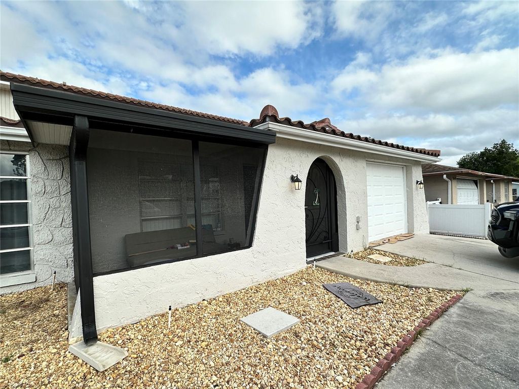 Photo of 9100 Suffolk Lane, Port Richey, FL 34668 (MLS # V4946217)