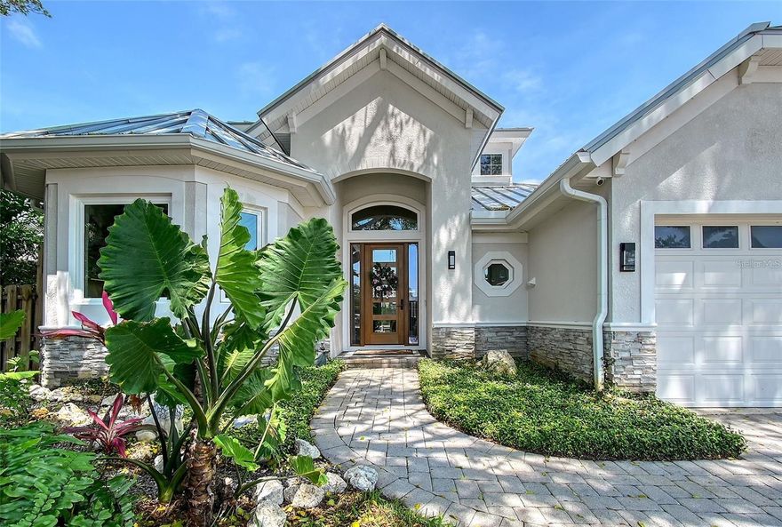 Beautifully Renovated Coastal Contemporary with Traditional Charm. This stunning 4-bedroom, 3-bath pool home nestled on a quiet cul-de-sac street in the coveted West of the Trail area between Granada and Oyster Bay. This exceptional residence features a thoughtfully designed open floor plan—not too open, but perfectly balanced for both living and entertaining. Inside, you’ll find luxury finishes throughout, with beautiful neutral tones and abundant natural light creating a warm, inviting atmosphere. The amazing chef’s kitchen is the heart of the home, complete with new luxury appliances, custom cabinetry, and elegant quartz countertops—ideal for hosting or daily living. The downstairs office provides a perfect work-from-home space, while the upstairs bonus loft offers flexible living for a second lounge, playroom, or media area. The primary suite and additional bedrooms are spacious and well-appointed, complemented by three stylish bathrooms. Step outside to your private poolside oasis, featuring a built-in BBQ grill with sink—perfect for family gatherings and entertaining friends. The fenced yard is beautifully landscaped with mature, manicured greenery and landscape lighting creating a serene setting and a secure space for pets. Additional highlights include: New standing seam aluminum metal roof (installed 2023) Spacious 3-car garage with a finished poly aspartic flaked floor easy to keep clean and durable and additional laundry amenities. Spacious attic above the garage for extra storage. Home per county records has an effective year built of 2020 All appliances replaced 2023-2024. Saltwater Pool and Spa. Located in a walking-friendly and golf cart-friendly neighborhood Prime location with unbeatable convenience: 10 minutes to Downtown Sarasota and Siesta Key Beach. Walking distance to Publix, Red Rock Park, and local restaurants. Close to Trader Joe’s, Cinebistro, and the Siesta Key Bridge for fishing. This beautifully updated home combines luxury finishes, functional design, and an unbeatable location—schedule your private showing today!