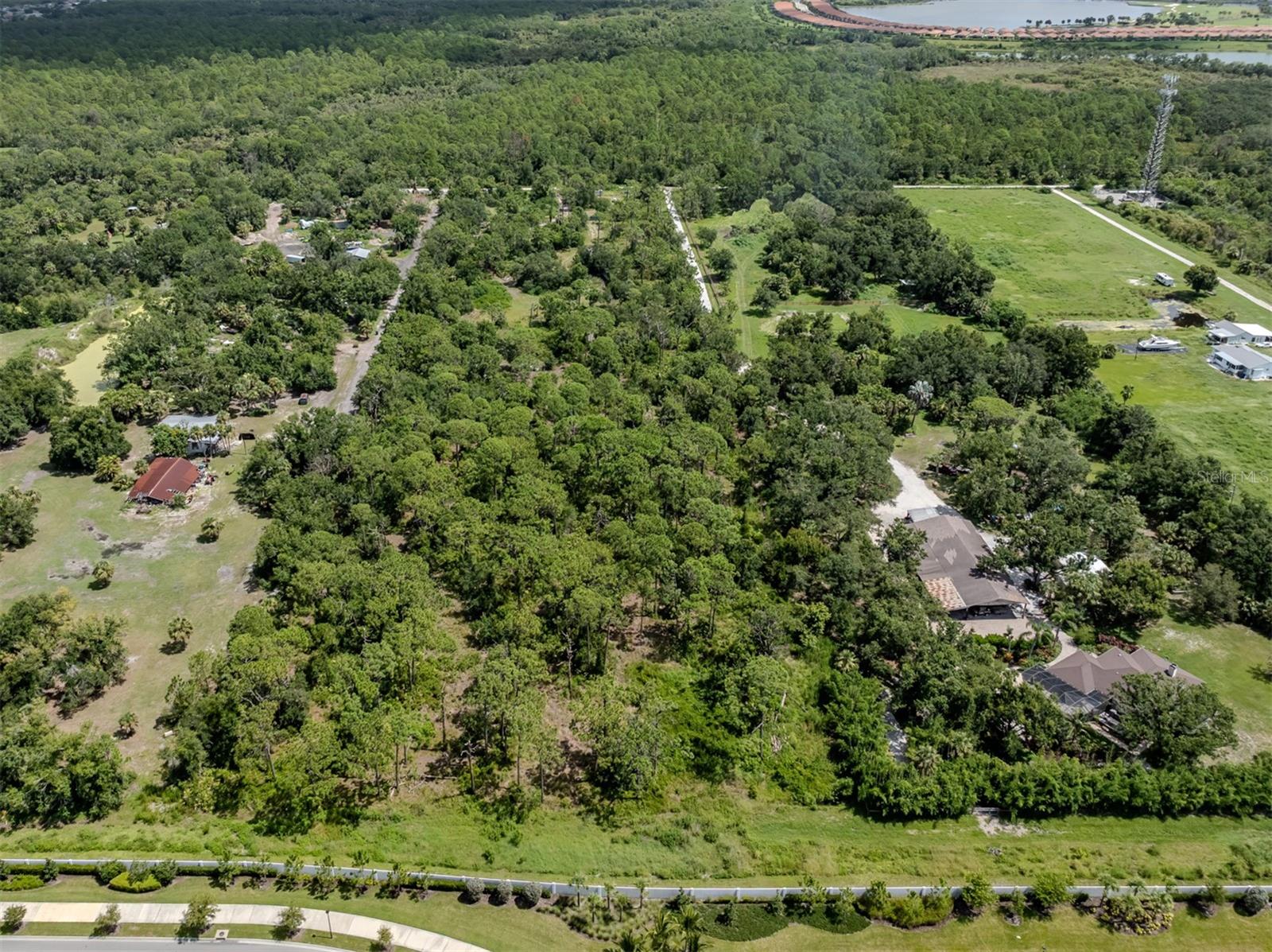 Discover an exceptional opportunity to own nearly 10 acres of pristine vacant land, perfectly positioned just 2.5 miles from the stunning shores of Manasota Beach on E. Manasota Beach Road in Englewood. This spacious 9.5 acre parcel offers prospective homeowners a rare chance to create their dream retreat, investment property, or private estate in a highly desirable coastal location. Imagine the possibilities: sprawling outdoor living spaces, lush gardens, or even a charming residential development—all within close proximity to the sun-kissed sands, turquoise waters, and vibrant community amenities that make this area so sought after. Whether you're an investor seeking lucrative potential or someone eager to build a personal sanctuary in paradise, this land presents an unmatched opportunity to capitalize on the natural beauty and convenience of Englewood's premier locale. Act now to secure this rare piece of Florida's coastal paradise and turn your vision into reality.