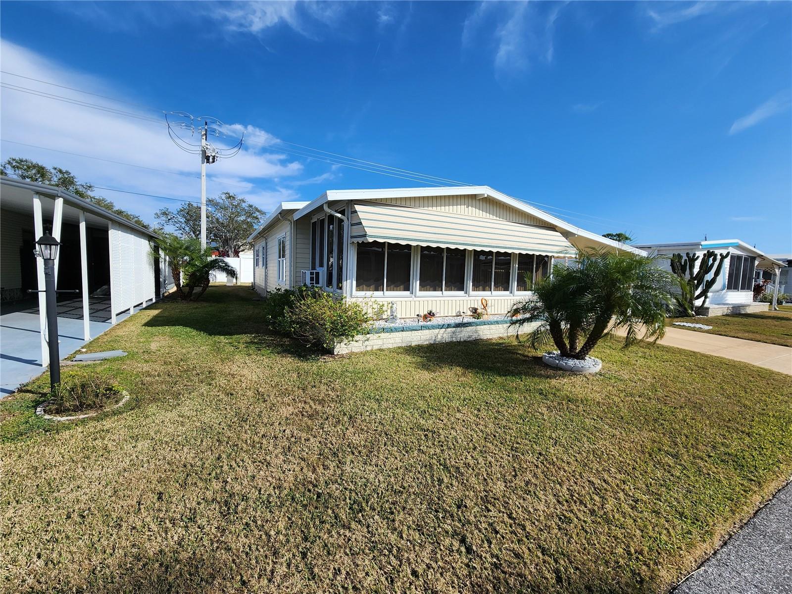 OWNER FINANCING AVAILABLE. Welcome to Palm Lake Estates – A 55+ Well-Maintained Community! Enjoy affordable Florida living in this updated 2-bedroom, 2-bath home with no lot rent and low maintenance fees! Recent updates include a modern kitchen with updated cabinets and countertops, 2023 A/C, water resistant vinyl plank flooring, newer windows, and an upgraded electric panel. The low monthly fee covers water, sewer, trash, cable, internet, community management, pool, and clubhouse all for only $225 monthly. Conveniently located near shopping, restaurants, the airport, and just minutes from stunning beaches. Perfect for a winter getaway or year-round living! Don't miss this opportunity—schedule your showing today!