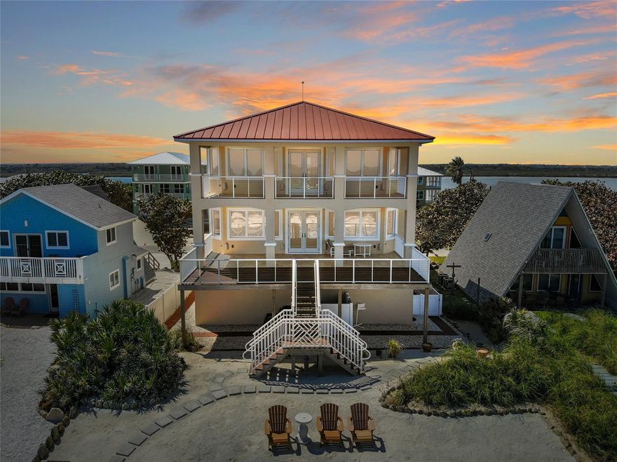 One of a kind, direct ocean front, custom built home located in Bethune Beach.  The views are endless from this one owner home and just two minutes to the Canaveral National Seashore.  Double rock revetment and the home sits approx.  Features four bedrooms, three full bathrooms and one-half bath plus one inside beach shower.  Come enjoy the three stories of living, with a poured concrete home where the seller has thought of everything.  Post tension cable/concrete subfloor for open layout and strength.   Icynene blown in attic to help keep low utility bills.  Stunning, upgraded elevator to help you navigate the home along with a striking staircase with rod iron railing.   The features throughout this home are beyond impressive. The floors throughout are a lovely travertine.  All of the wood cabinetry is custom along with the doors and trim. The doors are Anderson hurricane doors and PGT Hurricane sealed windows. The chef’s gourmet kitchen utilizes Thermador and Wolfe appliances including a wine refrigerator, butlers’ panty, granite countertops and a large walk-in pantry.  Extensive Mica lighting package throughout.  Remote control blinds on all ocean front windows.  Living room offers surround sound, built ins and gas fireplace.  The immense owner’s suite situated on the third level includes a fireplace, balcony with views of the ocean, sitting area and a custom walk-in closet. The owner’s bath is well appointed with a jacuzzi spa tub, walk in shower, and two vanities. There is also another bedroom with full bath and private patio to take in all the sunsets.  Office/fourth bedroom is located on the second level with river views and private balcony.   First level offers a lot of storage, two bedrooms with walk in closets and massive laundry room and access to the ocean.  Tiled, two car garages, oversized with on demand tankless hot water heater and central vacuum.   Low maintenance yard with two outdoor shower's (one heated). ;Water: City