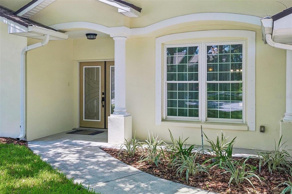 Photo of 818 Village Way, Palm Harbor, FL 34683 (MLS # TB8529656)