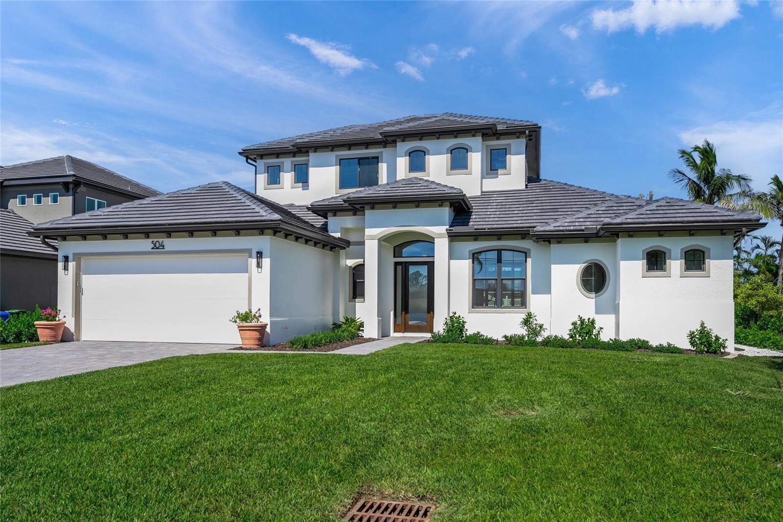 MODERN LUXURY LIVING ON VENICE ISLAND – NEW CUSTOM HOME
Discover the perfect blend of modern elegance, comfort and functionality in this brand-new 4-bedroom, 4.5-bath custom home, built by Caithness Construction LLC. Located just minutes from Venice Beach and historic Venice Main Street, this 2,800 sq ft residence offers an unparalleled Florida Gulf Coast lifestyle.
Step inside to an open-concept floor plan that effortlessly unites indoor and outdoor living. At the heart of the home is a gourmet kitchen featuring custom cabinetry, granite countertops, a large island with a Karran granite sink, a walk-in pantry and premium stainless-steel appliances, including an LG gas range and designer hood – perfect for entertaining and everyday living.
The owner’s suite offers a peaceful retreat with views of the tranquil pool and a luxurious ensuite bath. The main level also includes a guest bedroom with full bath, a dedicated home office/den, laundry room, and a private half bath. Upstairs, two additional bedrooms with walk-in closets and ensuite baths open to a versatile loft/bonus area, ideal for family, guests, or entertainment.
Outside, the private outdoor oasis features a saltwater pool with pebble sheen finish, waterfall feature and sun shelf, Travertine tile decking, No-See-Um high-density screened cage, and an outdoor kitchen rough-in—ready to be your dream entertaining space.
Constructed with quality and attention to detail, this home has solid core interior doors with modern casings and 6-inch baseboards throughout. The home also includes impact-resistant windows and sliders, insulated garage doors, and spray foam insulation for enhanced energy efficiency. For added peace of mind, both the home and street elevations exceed current flood zone requirements.
Enjoy easy access to the Venice Island lifestyle – walk, bike, or ride your golf cart to the beach, boutique shops and restaurants, Venice Theater, Farmer’s Market, Veinice Jetty's and the Venice Performing Arts Center. Don't miss this rare opportunity to own a brand-new, move-in ready home in one of Florida’s most vibrant coastal communities.