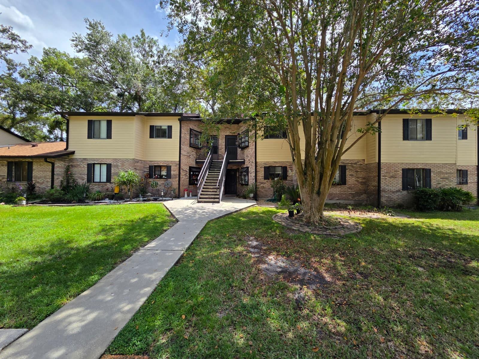 Ready to move in. For rent this welcoming 2-bedroom, 2-bath residence in the desirable Foxhall Condominiums. Enjoy soaring ceilings and plenty of natural light streaming through sliding glass doors that open to your private balcony. The spacious living room includes a charming fireplace, while the kitchen comes fully equipped with all appliances. Additional features include vinyl flooring throughout and the convenience of an in-unit washer and dryer. The community also offers a sparkling pool, all within a peaceful, well-established neighborhood. Centrally located, this home provides easy access to The Loop, top shopping and dining, amusement parks, and major highways including the Turnpike and I-4!
