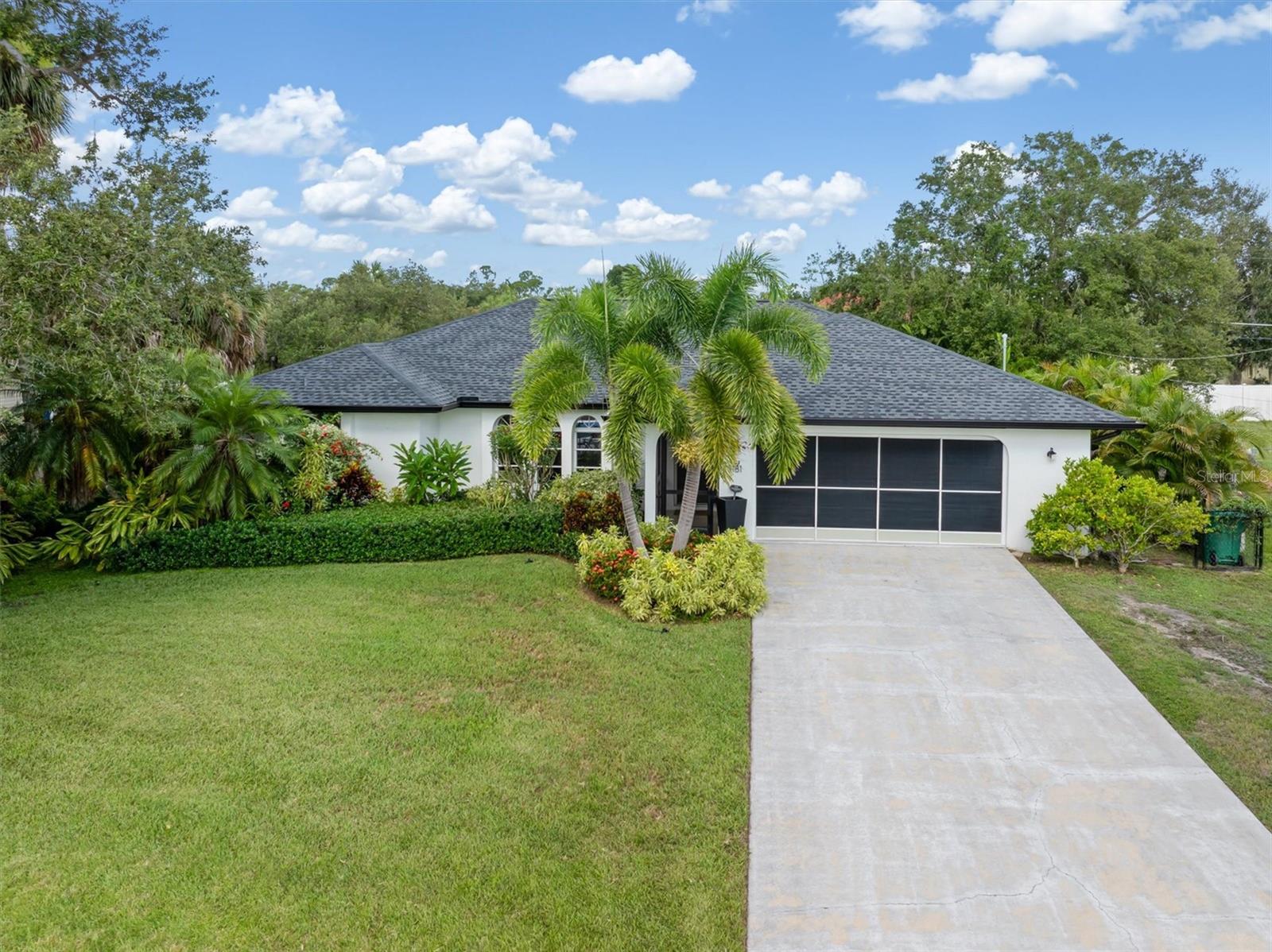 Welcome to your private paradise, in this stunning Port Charlotte pool home. Nestled on a peaceful street away from the hustle and bustle, this residence offers the perfect blend of tranquility and convenience. With a spacious 1900 square feet of heated living space, this 3-bedroom, 2.5-bath home is designed for both relaxing and entertaining. The thoughtful split-floor plan ensures privacy for family and guest alike, with excellent views of the pool area from multiple points in the home. The kitchen sits at the heart of the home with central access to all of the living, dining, and outdoor areas. Step in the backyard to discover a true Florida oasis. The expansive screened lanai houses a sparkling heated pool, inviting you to take a dip year-round. Lush mature landscaping and fencing provide privacy and ambiance, perfect for sunbathing, barbecuing, or simply unwinding at the end of the day. While you'll feel worlds away in this peaceful setting, you're just a stone's throw from all of Port Charlotte's best amenities. Enjoy the convenience of being minutes from premier shopping, delicious dining, and exciting entertainment options. This is more than just a home; it's a lifestyle. Don't miss your chance to own a piece of Port Charlotte's paradise!