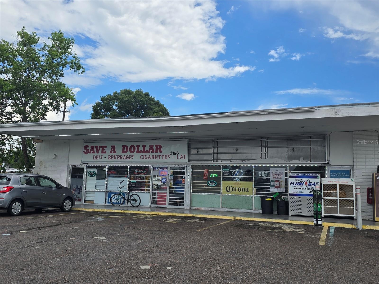 Plenty of opportunity for this income producing property! Building is for Sale with plenty of opportunities! Front unit is Save a Dollar Convenience Store while the separate entrance on the side of the building is vacant. Prime Location in North St Pete!! Endless opportunities to create something unique