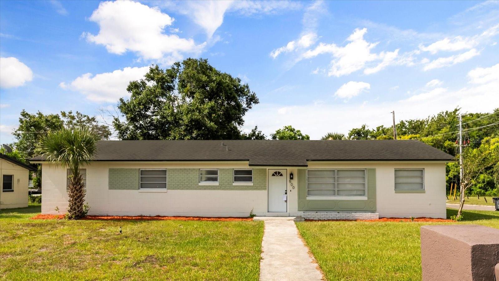 Beautiful corner lot home in the growing Maitland community - sitting on an over 9000 square-foot lot!! This home has been elegantly designed, with modern finishes! Upon arrival, you will find an ample corner lot with plenty of space, and a 2 car garage off to the side. Upon entry, you will see a truly spacious open floor plan, with the view of the new kitchen, separate dining area, and ample sized living room. The kitchen features new cabinets, stainless steel appliances, new quartz, and a spacious bar, perfect for a quick meal or a work from home space. Past the kitchen is the laundry room and pantry area. Back out past the kitchen is the separate dining room, huge living, perfect for entertaining, featuring a fireplace, and an additional office space/flex space with its own entry to the backyard. Past the living room to your left is the newly done hallway bath, featuring beautiful vanities, double sinks, newly tiled shower, commode, and fixtures throughout. On the right of this hallway are three perfectly sized bedrooms, and towards the end of the hallway is the truly massive ensuite master bedroom. The ensuite master bedroom is large enough to put a cozy loveseat, as well as a king sized bed, and features a beautiful ensuite master bath. The master bath features a new vanity, tile throughout, commode, and fixtures. This home features updated light fixtures and fans throughout. Heading to the backyard, you will find plenty of space for those summer nights to have friends and family for a BBQ and a great time. Come see this one-of-a-kind spacious corner home today which is minutes from Winter Park Village and Maitland Farmers Market! (ROOF PERMIT PENDING, NEW ROOF TO BE INSTALLED UPON CLOSING)