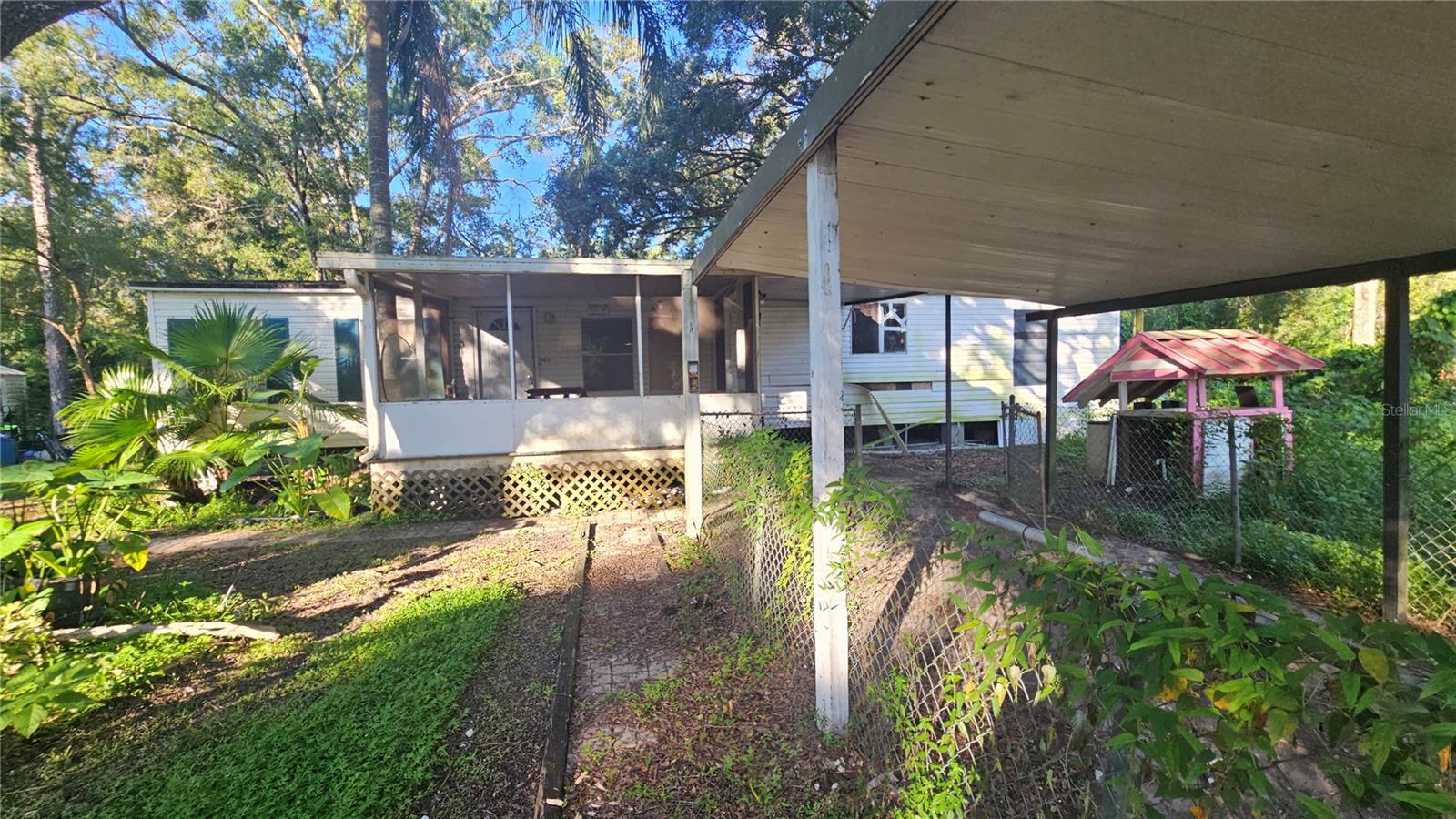This is a large Manufactured home in need of major repair or full replacement. The property is a huge beautiful lot deep into Moon Lake Estates. The home is a 2 bedroom 2 bath with a full laundry room. Room sizes are approximate.