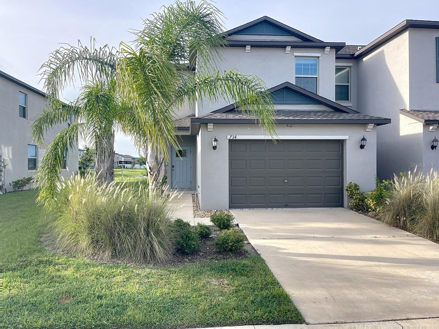 This townhouse is eligible for USDA financing (Zero down payment if qualifying). NO CDD, LOW HOA! Built in 2021, this home boasts a modern, functional, and inviting design with a perfect blend of style and functionality. The open floor plan creates a spacious and airy atmosphere on the first floor, giving the space a contemporary feel as you enter. A spacious half bathroom is conveniently located on the first floor for guests. The kitchen features elegant granite countertops and stainless steel appliances, providing luxury and durability. The eating space is perfect for cooking and entertaining. There's a cozy eating space within the kitchen, ideal for casual meals or family gatherings. The kitchen is outfitted with beautiful granite countertops and stainless steel appliances, Upstairs, you'll find three well-sized bedrooms offering ample space and natural light. The master bedroom includes its en-suite bathroom, providing a private retreat. The other two bedrooms share a full bathroom, making it ideal for family, guests, or a home office. Additional features include a two-car garage with storage space. At the rear, you'll find a covered back lanai, perfect for enjoying outdoor moments. It's an ideal spot for relaxation or entertaining guests. The home is designed to be both stylish and practical, blending modern amenities with cozy, comfortable living spaces.