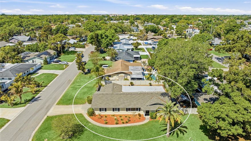 Welcome to this 3-bedroom, 2-bathroom home in Northwest Bradenton, just minutes from Anna Maria Island and Robinson Preserve. Situated on a spacious corner lot in a quiet, established neighborhood, this property offers privacy with a fenced backyard, along with the benefit of no HOA restrictions. Recent updates include a newer roof and a 2024-installed AC, offering added peace of mind for the next owner. Inside, the home features a functional layout with both a living room and a family room, providing multiple spaces for relaxing or entertaining. The kitchen is centrally located and thoughtfully designed with ample cabinet storage and a breakfast bar that adds both function and casual seating. Privately positioned, the primary suite serves as a comfortable retreat with its own en suite bathroom and walk-in closet. Two additional bedrooms and a guest bath provide flexibility for family, visitors, or a dedicated office space. Designed to embrace Florida living, the outdoor space features a screened lanai overlooking the sparkling private pool and fenced backyard. The yard is clean, manageable, and offers additional space for grilling, gardening, or simply enjoying the outdoors in a private setting. Conveniently located near shopping, dining, and beaches, this home offers a great combination of location and flexibility.