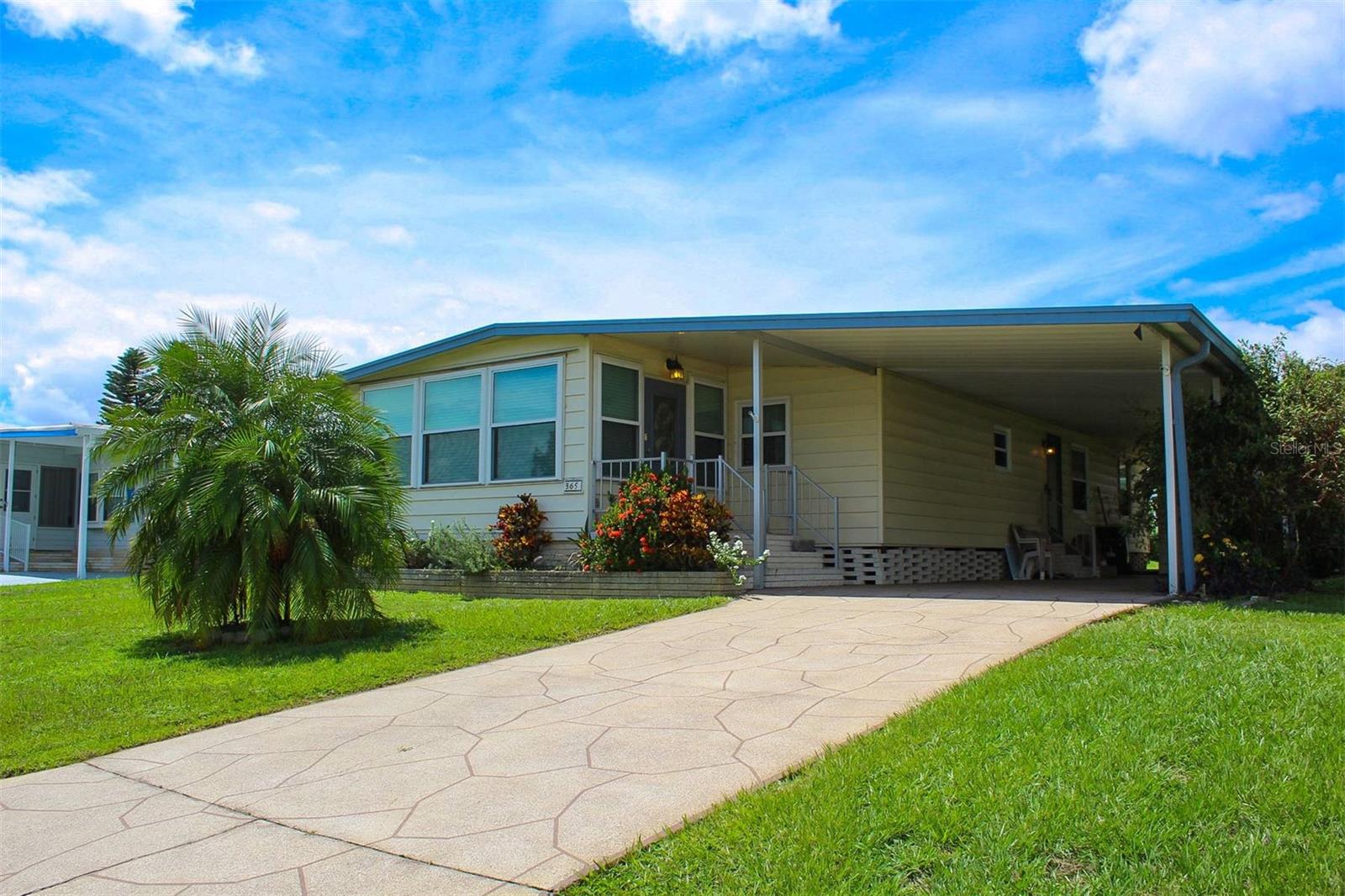Lovely 2 bedroom 2 bathroom home located in a 55+ community with no lot rent. Most windows have been replaced and a leaf filter system was added. The kitchen offers a seating area at the counter and a closet pantry. Formal dining room has a built in hutch area with plenty of storage space and lighted display areas. The home has a living room, family room and Florida room. The Florida room is not included in the 1104 sq footage shown in public records. The primary bedroom has a private bath and walk in closet. The home is being sold partially furnished and decorated. The carport area offers a storage area/workshop with an extended area for the washer and dryer. This active community features a heated community pool, shuffleboard courts and a community center with many scheduled activities.