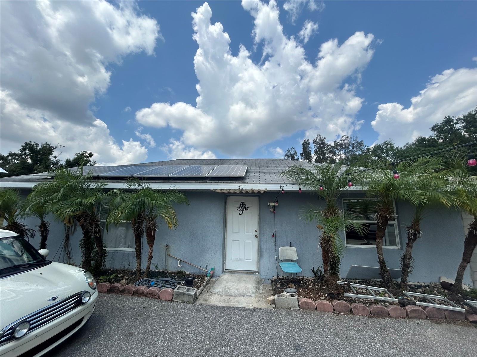 Concrete Block Beauty on 1.3 Acres. Looking for space to spread out, but still want to be minutes from town? This 2 bedroom, 1 bathroom concrete block home sits on 1.3 acres fully fenced acres just 6 minutes from Walmart and Publix in Arcadia. Built with practicality in mind, this home offers ample parking, multiple storage structures, and asphalt driveway access all the way around the property. Inside, you'll find a bright, open floor plan with no carpet and a seamless flow between the kitchen and living area. The attached concrete block garage is partially finished. It is ideal for a workshop, extra storage, or a future bonus flex room. Bring your boats, RV,s trailers, trucks, and toys galore. This property was made for it. Additionally it highlights solar power system, quiet location near end of the road, durable block construction (not manufactured home), and plenty of room to grow or build. Whether you're an outdoor enthusiast, small business owner needing space, or just craving elblow room close to town, this one's for you! Won't last as this is a unique property due to location, lot size, and construction.