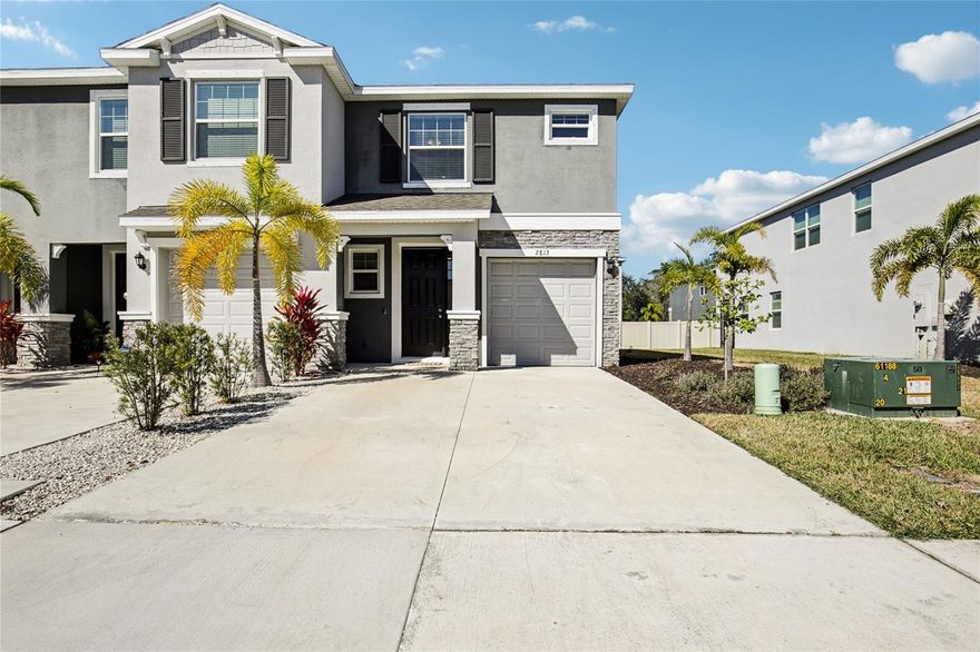 Beautiful jewel found in Bay Landing! Built in 2022, this end-unit townhome looks and feels brand new, offering a bright, open floor plan with tasteful improvements and beautiful light and bright Florida white cabinetry! Take peace of mind and receive insurance discounts with an insulated storm rated front door and heavy gauge metal shutters! Inside, the stylish kitchen features granite countertops, Stainless Steel appliances, subway tile backsplash, a walk-in pantry, and more! Sparkling large ceramic tile fill the first floor and upper floor bathroom spaces. Energy efficient insulation blown in to the newer Roof, newer Hot Water Heater and newer HVAC system have all been well maintained and keep your home comfortable. Low E, energy efficient double pane, tinted windows keep your home cool in the summer and warm in the winter. Upstairs, spacious separate bedrooms and a flexible loft provide room to relax, work and unwind. Enjoy added privacy with poured concrete block construction and a concrete party wall.  You'll appreciate everyday conveniences including a smart-home package, washer/dryer inside, one-car garage and two exterior parking spaces. The screen enclosed lanai open to the green belt is a wonderful private outdoor space to cookout, relax in the fresh air and enjoy Florida,  . Residents enjoy a gorgeous resort-style pool, fitness center, dog park, playground and more. Minutes from Waterside Place, Lakewood Ranch, UTC, Downtown Sarasota, and the world renowned beaches! No CDD fees and low HOA dues make this gorgeous home a standout value! Call today to schedule a private tour and see for yourself!