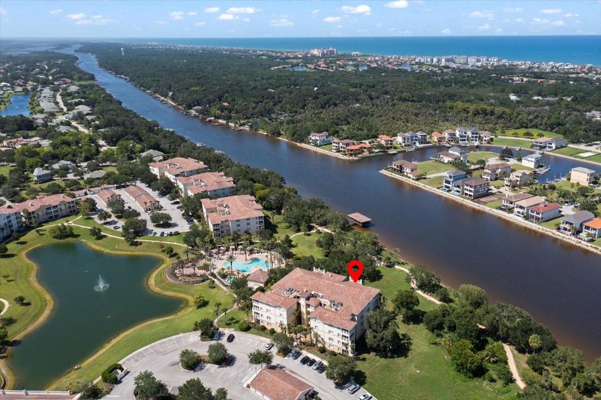 One or more photo(s) has been virtually staged. Rare opportunity to purchase a top level Tidelands condo with direct Intracoastal views and garage! This home has been lovingly maintained and is move-in ready. With 3 bedrooms, 2 full baths, and ample living and dining space, the interior spaces of this home are highlighted by up to 12-ft ceilings - a benefit of being on the top floor. At the front of the home, you are greeted by a tiled entry foyer, two spacious secondary bedrooms, a full bath and hall laundry (washer and dryer remain). The heart of the home is an entertainer's kitchen complete with stainless steel appliances, solid wood stained cabinetry, granite countertops, a brand new tile backsplash, breakfast bar, and is pre-wired for you to add two beautiful pendant lights. Adjacent is the open dining room, which provides plenty of seating for your large groups. Your eye is drawn through the triple sliding glass doors of the large great room out to the view of the live oak trees and the Intracoastal Waterway! Imagine sipping your morning coffee on the large screened balcony while watching the boats and even dolphins go by! Last but certainly not least is the primary suite, which features a sliding door out to the balcony, double cedar closets, a double vanity, soaking tub and walk-in shower. Luxury vinyl planks floors for easy maintenance, as well as plantation shutters and remote shades throughout for light control and privacy. An added bonus of this unit is the garage, which can be used for parking or to store all your extras! The Tidelands community boasts two pools with hot tubs (one is right next to the building), tennis courts, ponds with viewing areas, dock, a clubhouse with multi-purpose rooms, a game room, and fitness center. Don't miss this amazing opportunity to experience the natural beauty and waterfront lifestyle that Tidelands provides!