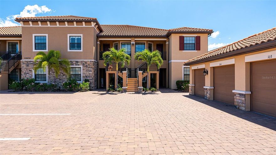 A beautiful second–floor condominium in Esplanade Golf and Country Club awaits you with spectacular views of the pristine 10th green and a surrounding sparkling pond. Enjoy resort-style amenities and a deeded full golf membership as you begin living your best life in this vibrant community. Soaring vaulted ceilings and the open floor-plan provide a feeling of spaciousness, as well as a warm and inviting ambiance for relaxation and the enjoyment of friends and family.. Recently installed luxury vinyl plank flooring in the main areas is a fantastic upgrade, as is the tall column of matching white kitchen cabinetry that enlarges the eat -in kitchen as well as providing additional storage. A breakfast nook with plantation shutters overlooks the front porch, an ideal place for taking in the colorful sunsets. The primary bedroom is en-suite with dual sinks, two walk-in closets, a large walk-in shower, and white plantation shutters. The guest bedroom also showcases plantation shutters and can accommodate a king bed. Stacking sliding doors open to the covered, screened lanai which provide the ideal spot for enjoying a coffee while watching the sunrise over the long, sweeping views of the 10th fairway and sparkling pond. A one-car garage and a parking space is included. You can experience all the advantages of the Lakewood Ranch lifestyle while enjoying the unmatched Esplanade amenities such as the 18-hole championship golf course, eight Har-Tru lighted tennis courts and eight lighted pickleball courts, bocce ball, two large resort-style pools, one with a walking resistance pool and the other with a hot tub. Two clubhouses are outfitted with fitness centers and offer an array of options including fitness classes, card games, hobby rooms, the Koquina Sand Spa, and rooms for private parties. Lakewood Ranch is the top-selling planned community in the nation. Come and live your best life!