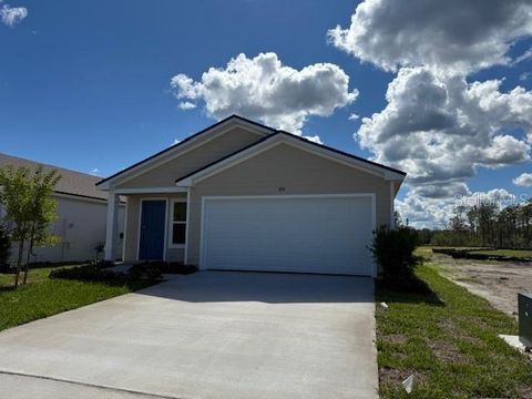 Photo of 854 Grand Reserve Drive, Bunnell, FL 32110 (MLS # FC313005) Photo of 854 Grand Reserve Drive, Bunnell, FL 32110 (MLS # FC313005)
