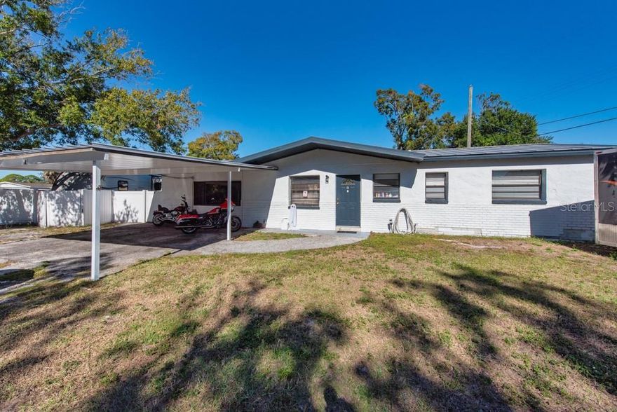 A smart layout, stylish upgrades, and built-in income potential come together in this recently renovated Tampa Bay home—designed to fit today’s lifestyle and tomorrow’s opportunities. Set on a generous 0.17-acre corner lot, this 1,320 sq ft home was thoughtfully renovated in 2023 and designed to adapt to the way you live today. Whether you’re looking for a primary residence with room for extended family or a smart investment opportunity, this property delivers on all fronts. The main residence features 3 bedrooms and 2 bathrooms, highlighted by an open-concept layout, elegant porcelain tile flooring, and energy-efficient LED lighting throughout. The gourmet kitchen anchors the space with quartz countertops, a breakfast bar, and newer appliances, making it ideal for both everyday living and entertaining. What truly sets this home apart is the attached mother-in-law suite, complete with 1 bedroom, a full bathroom, and a kitchenette. Currently operating as a successful Airbnb with consistent bookings, it offers immediate income potential or a private space for guests, multigenerational living, or a home office setup. With this addition, the property functions as a 4-bedroom, 3-bath home. Step outside to your own private retreat featuring a screened, heated in-ground pool and hot tub, perfect for year-round enjoyment. The fully fenced backyard provides privacy, while ample parking—including space for boats and RVs—adds exceptional convenience. Located in a quiet neighborhood, this home offers unbeatable access to Tampa Bay’s best amenities. You’re just minutes from Memorial Highway and the Veterans Expressway, 8 minutes from Tampa International Airport, and 6 minutes from Ben T Davis Beach and the Courtney Campbell Causeway. Enjoy nearby top-rated restaurants, Rocky Point Golf Course, parks, and shopping plazas, all within easy reach. This is a home that works for you—live in it, earn from it, or do both. A standout opportunity in a prime Tampa location. ***FREE 1/0 Rate Buydown when using the seller's preferred lender!***