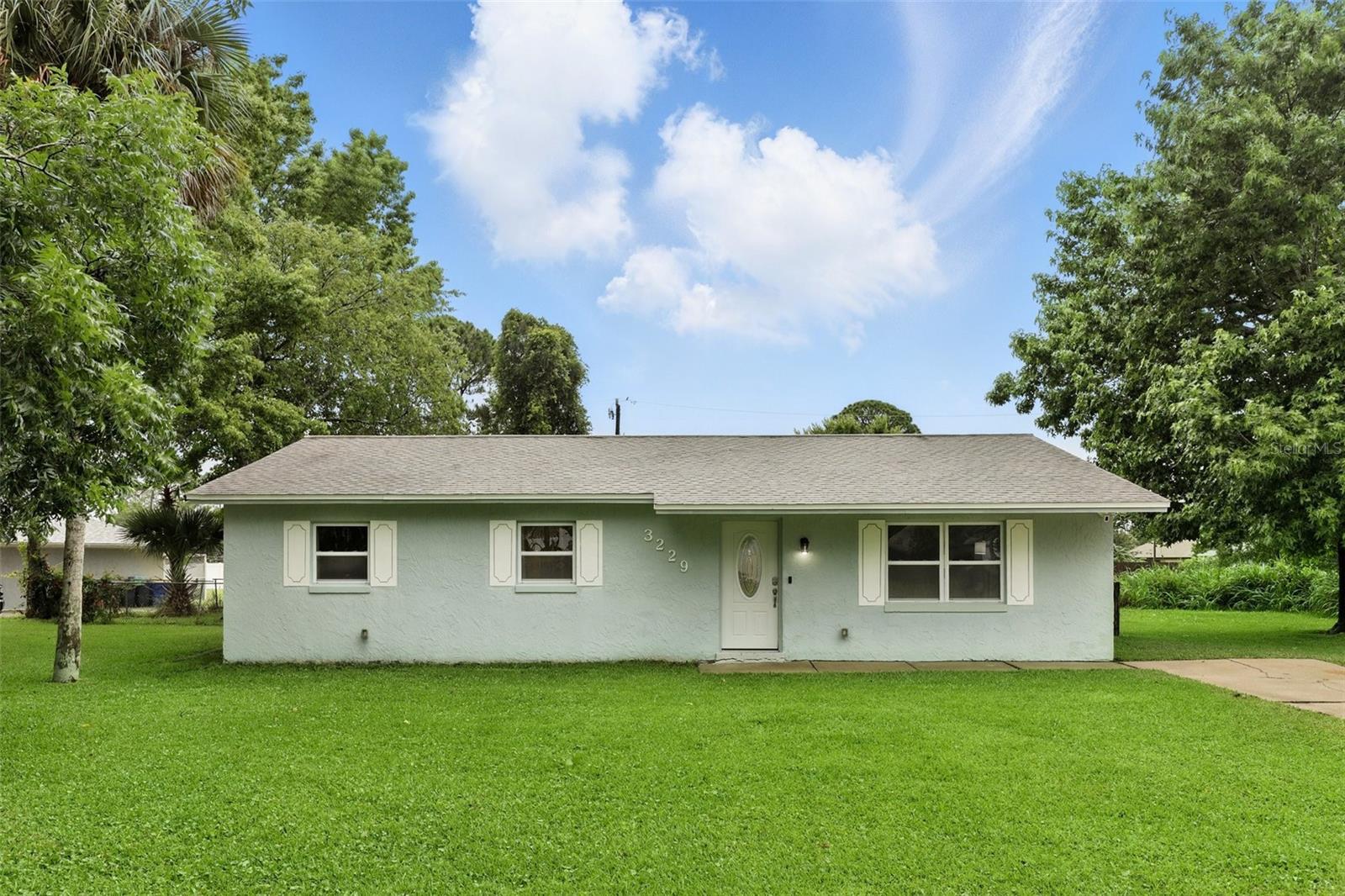 Move-In Ready 3-Bedroom Home in Prime Edgewater Location! Welcome home to 3229 Sabal Palm Dr, a beautifully maintained 3-bedroom, 2-bathroom home located in the heart of Edgewater. This home sits on a spacious lot with a large backyard, over a third of an acre, perfect for outdoor living and entertaining. Inside, the home features a bright and open layout with several modern updates. The primary bathroom has been fully remodeled, and the entire home has been freshly painted. Updated light fixtures add a modern touch to each room. The kitchen offers ample counter space and storage, making it ideal for cooking and daily living. Each bedroom receives plenty of natural light and includes generous closet space. This home has no rental restrictions, making it a great option for both homeowners and investors. There is also no HOA, offering added flexibility and freedom. The location provides easy access to shopping, dining, parks, the beach, and major highways. Edgewater is a walkable and vibrant community known for its bay views, dog-friendly parks, and diverse restaurants. Schedule your private showing today and discover everything this move-in ready home has to provide.