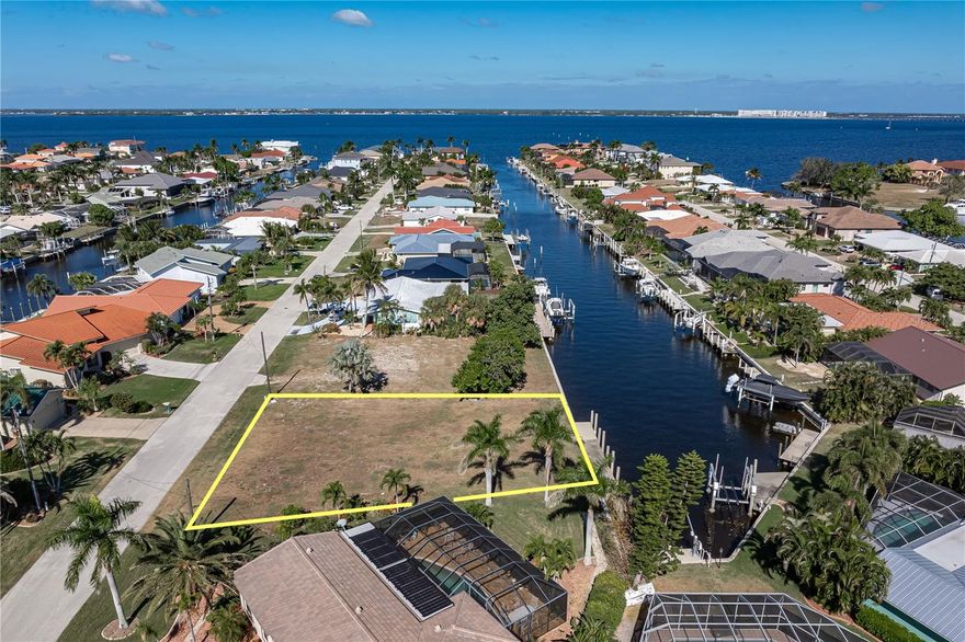 WATERFRONT LOT IN PGI W/45 FT DOCK & INSTANT SAILBOAT ACCESS! This fantastic, waterfront property features 75ft of seawall, deep water sailboat access & a 45ft concrete dock already in place. Dock your boat before you can park your car! **Property is ONLY 16 LOTS FROM THE HARBOR.** Set sail on your latest adventure from your own backyard & reach open water in mere minutes. Build your Florida dream home here and keep your boat just steps from your backdoor. Lot is surrounded by custom homes - it's the perfect spot to build your dream home - NO MANDATORY HOA here. Consider adding it to your investment portfolio & hold on to it as the area grows & develops. Lot dimensions for the property are 95x120x75x121 w/75ft of seawall. 95ft of street frontage is perfect for your three-car garage. Property has city water & sewer as well as a concrete seawall that is maintained by the City of Punta Gorda. Start enjoying some of the finest boating & fishing directly from your backyard. Punta Gorda has an active art & music scene in addition to boating, golf, tennis, pickleball & kayaking clubs. Discover why Punta Gorda is consistently rated as one of the best places to live. Choose a spot where you can boat from your backyard & play golf just around the corner. Visit the property today.