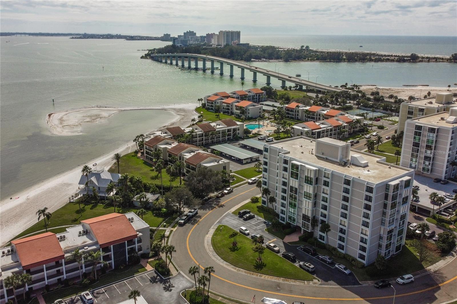 Enjoy resort-style living at this waterfront community. This spacious 2br/2Ba unit has a lovely view of the boats coming and going from the main channel to the Gulf. You will have a front row seat watching all of the boat tours head out including the Pirate Ship, Sea Screamer, and the dolphin tours. Clearwater Point, this waterfront community is just a short stroll to the sparkling stretches of its own private sandy beach on the Intercostals waterway. . Did I mention a private, resident only beach steps from your front door? When the Florida sun is warm, take a dip in one of 3 sparkling community heated swimming pools, monitored by security gards. Take advantage of the BEACHFRONT BBQ area, perfect for entertaining family and friends and outdoor facilities with showers.Assigned 1 under building parking space #49 and there is additional parking outside. Bicycle storage available in the secured bike room. This condo has it all! Enjoy romantic walks on the beach with many restaurants nearby! This location is amazing! Lobby is Key Card Entry.