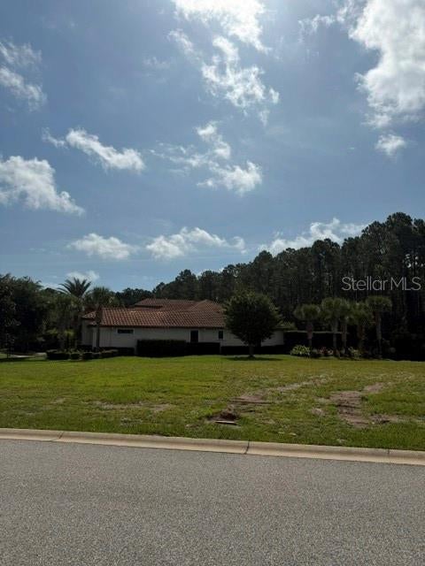 Photo of 515 Sweetgum Ln, Palm Coast, FL 32137 (MLS # FC320150)