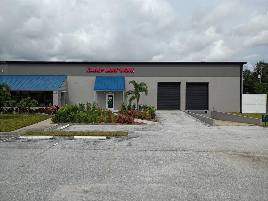 Bank owned foreclosure - industrial building renovated for use as  a dog day care facility.  10,250 sf warehouse property with approximately 3k sf of buildout space for office and dog care use and over 7k sf of open space for warehouse.  18 ft high ceilings, two 10x12 overhead doors with one grade level and one dock height.  Interior soffit built on inside to cover overhead doors so they are not visible currently inside but they exist.  Three phase power service.  Close to Clearwater airport off of Ulmerton.