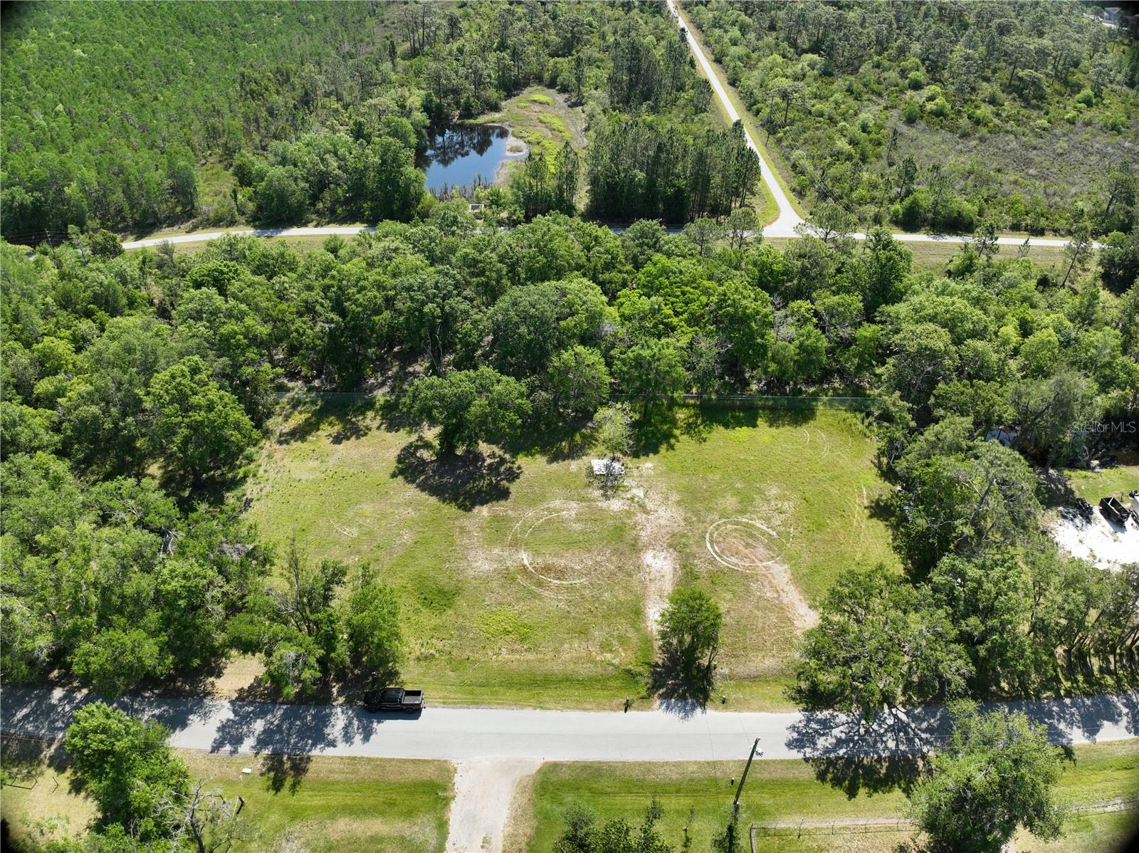 At last! You've found your perfect property! Enjoy serene country living within minutes of North Tampa's shopping and restaurants. This recently cleared, one acre lot allows you the time and flexibility to dream, design and build your dream home. Imagine... a peaceful country lifestyle with the benefit of easy access to the Suncoast Parkway providing short commutes to the Tampa International Airport, International Mall and local beaches. With no deed restrictions (per Pasco County records), CDD/HOA fees or wetlands, this lot is "ready to build". Value added features include a recently completed survey, new well (pump & tank required), and a credit of approximately $14,000 toward Pasco County impact fees. The total value of improvements and credits comes to approximately $46,450! So... what are you waiting for? Contact me today before someone makes off with your dream home on a dream property.
i