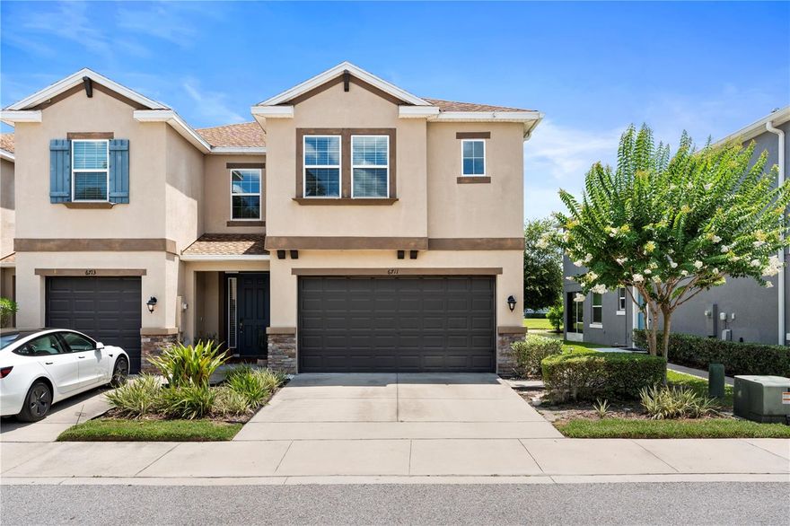 Welcome to 6711 Rocky Park Street in the sought-after Bridgehaven community! This stunning end-unit townhome is loaded with upgrades and sits right on the pond, giving you extra privacy and peaceful water views. Inside, you’ll find 3 bedrooms, 2.5 baths, and over 1,850 sq. ft. of modern, open-concept living. The kitchen is a total showstopper with quartz countertops, a huge island that seats four, stainless steel appliances, and a spacious walk-in pantry. It’s perfect for entertaining or just making everyday life feel a little extra. Upstairs features a cozy loft space that can be your office, lounge, or flex room. The guest bedrooms share a Jack & Jill bath, and the primary suite is your own private retreat with a spa-style bathroom—double vanity, oversized walk-in shower, and a private water closet. Upgrades include tile flooring downstairs and plush carpet in the bedrooms. You’ll also love the upstairs laundry, downstairs powder bath, and the two-car garage with bonus storage. Plus: hurricane shutters and an in-wall pest control system for extra peace of mind. Living in Bridgehaven means low-maintenance living with cable and internet included, access to a beautiful resort-style pool, and well-kept green spaces. You’re just minutes from the Veterans Expressway, Citrus Park Mall, Publix, Tampa International Airport, and beaches—everything you need, right at your fingertips. Schedule your showing today!