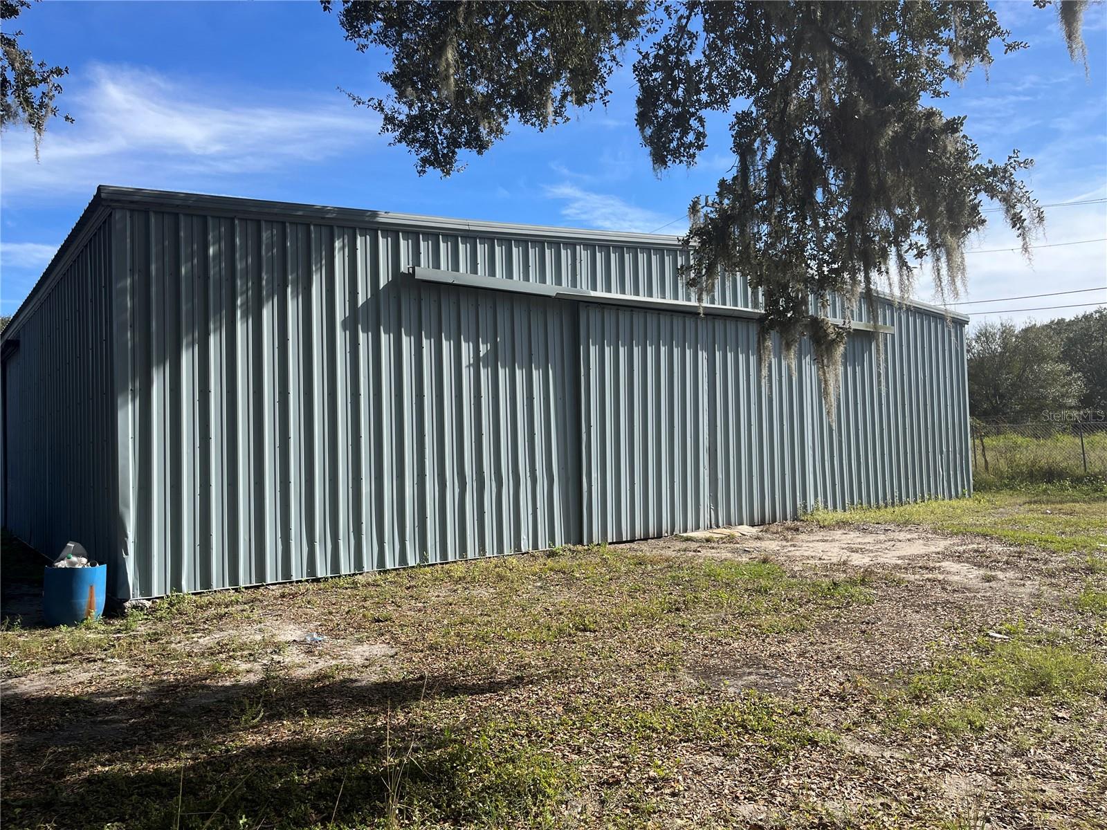 Here is a great opportunity to own a nice warehouse. perfect to grow your business or use it as an income producing property. Lots of demand for this type of rentals in the area. Plenty of parking all around the building. The area is growing fast, as its closer to I4 and about 6 mile from the manheim auto auction. This property was used as a bodyshop and still has a spray booth, a frame machine and lift, the is split into 3 units. The next door vacant land can also be sold , if more space is needed for the buyer however that parcel is still zoned residential.
Each of the 3 building has a bathroom, and the bigger building has a shed office .All measurements are approximate. All info provided are deemed to be correct but not guaranteed , please double check if you have any concerns. Property sold AS IS .