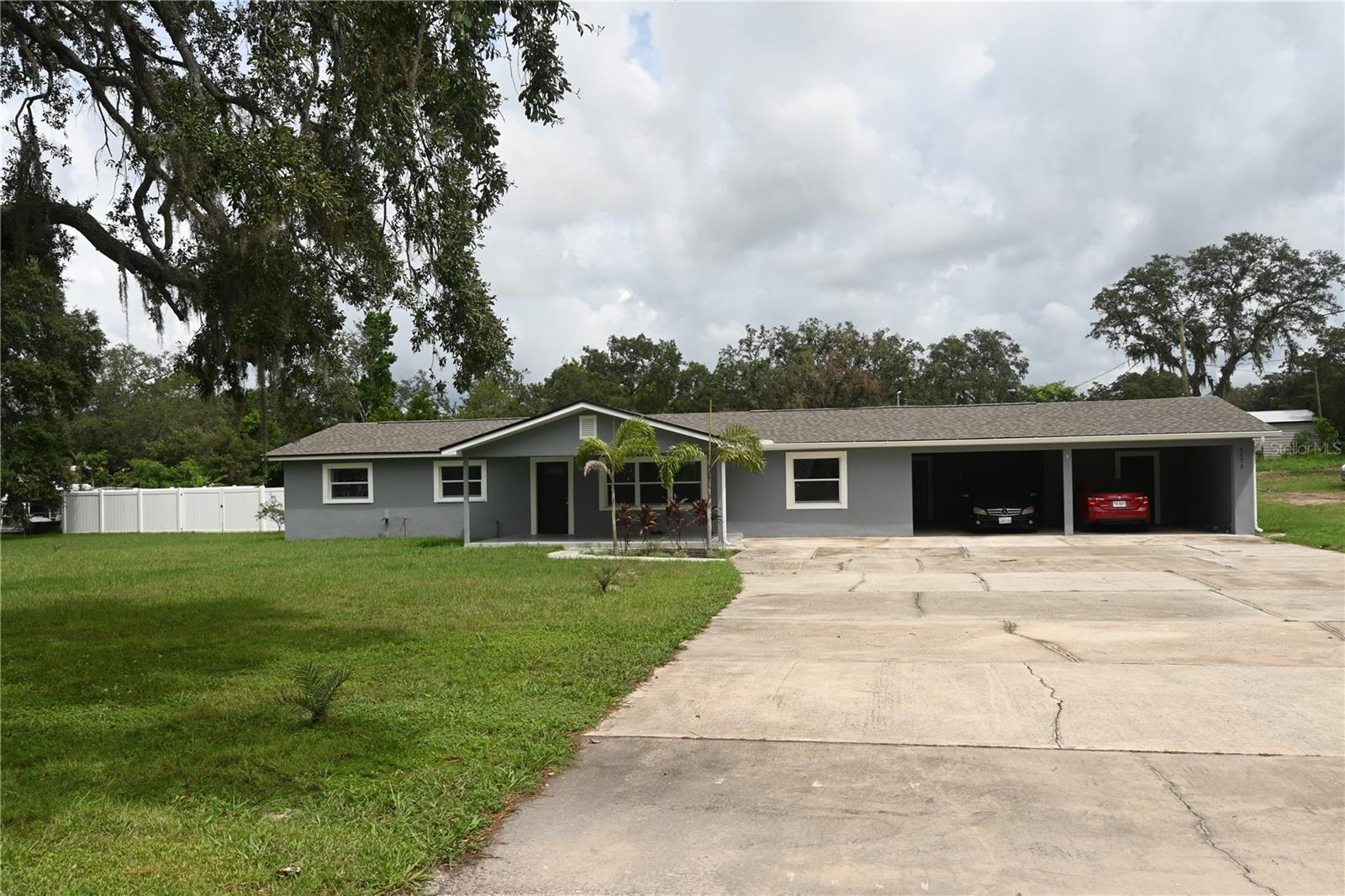 INCOME PRODUCING PROPERTY! This property consists of 2 homes on just under 2 acres. The first home is a fully renovated 2,308 square feet, 4 bedroom/2-bathroom rental property that is fully occupied. The entire home features easy-to-maintain ceramic tile flooring, a brand-new roof, and all new appliances and fixtures. The shared spaces of the home are large, bright and inviting. The second home is a 950 square foot 3 bedroom/2-bathroom rental next door. This home has maintained a long-term tenant whose lease can be transferred to the new owner. For those who love the outdoors, both properties have a HUGE front and back yard, long driveways, and a carport to store vehicles and outdoor equipment. The larger home is complete with a fenced in back patio, a shed and small outdoor storage building.
