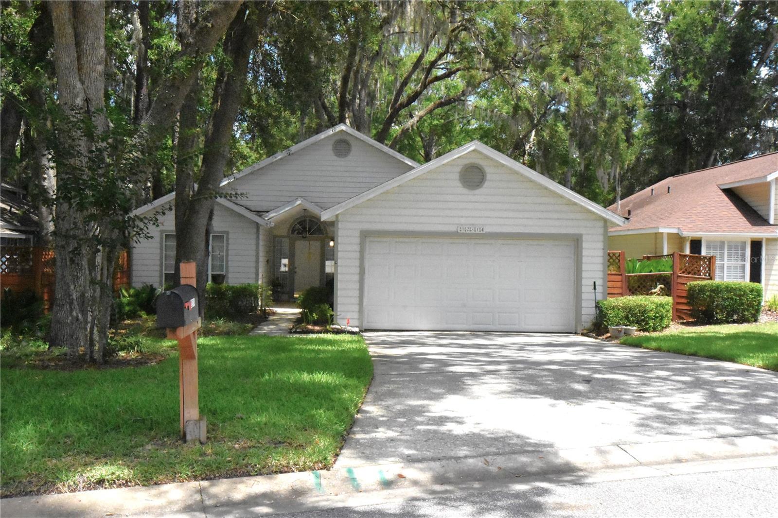 Turnkey Home in Highly Desirable Patio Homes of West End! This home comes with fantastic community amenities including a pool, club house, tennis court, walking trails, and front lawn maintenance. While boasting a very low $85 a month HOA fee. Another benefit is Clay Electric is the power provider, providing lower rates. New Roof 2025! Fenced back yard. Open floor plan with high ceilings in the living area. As you walk in the front door, opens to Great Room, Guest bedroom at front left of the house w/guest bath, master suite at back of house. Kitchen is open & spacious with eat in dining area. Plenty of storage & cabinets throughout the home. First class enclosed Florida Room just off of the living area to the right of the home w/separate AC. Large 2 Car finished garage with side exit door. This home provides that cozy cottage home feel! Home is move in ready! Great location with short commute to UF, Santa Fe College, Shands & North Florida Hospitals, shopping, & restaurants. A must see!