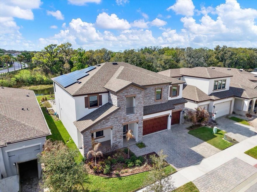 CLOSING COST ASSISTANCE AVAILABLE! Don’t wait to build your dream home, this Homes by WestBay Virginia Park model is move-in ready and showcases over $150K in seller upgrades! The sellers are relocating, highly motivated, and willing to assist with closing costs! Experience resort-style Florida living with a heated saltwater pool, spa, and solar, all overlooking a peaceful pond and conservation views in the highly desirable Triple Creek community. This beautifully upgraded two-story home features an elegant, spacious open floor plan designed for everyday living and entertaining, with multi-generational living possibilities. Featuring 5 bedrooms, 4 full baths, a private office (or optional 6th bedroom), a large bonus room, and a 3-car garage, this home truly has it all. A covered front porch welcomes you into a grand foyer through double entry doors, setting the tone for the home’s refined design. Just off the entry is a private office with double doors, perfect for working from home. The heart of the home is the expansive grand room, dining area, and chef’s kitchen, complete with Stainless steel GE appliances, Calacatta Novello Corian Quartz countertops, Sonoma Duraform Linen cabinetry with upgraded hardware, and Designer backsplash. Luxury vinyl plank flooring flows seamlessly throughout the main living areas, adding both beauty and durability. Sliding glass doors open to a spacious covered lanai and extended paver patio, creating the perfect indoor-outdoor living space. The backyard is a private retreat, featuring a heated saltwater pool and spa (2025) with serene water and conservation views. The first floor also includes a private guest suite with a full bath, ideal for visitors or multi-generational living. Upstairs, you’ll find a large bonus room, three generously sized secondary bedrooms with walk-in closets, a Jack-and-Jill bathroom, and a convenient upstairs laundry room. The owner’s retreat is a private sanctuary with double-door entry, a spacious walk-in closet, and a well-appointed en-suite bath. Additional upgrades include solar panels, custom interior paint, upgraded lighting fixtures, designer window treatments, surround-sound wiring (bonus & family rooms), a whole-home water treatment system, and more! Located in the sought-after Triple Creek master-planned community, residents enjoy two Clubhouses, Resort-style pools & splash pad, Tennis & basketball courts, Fitness centers, Playgrounds, and Miles of walking and biking trails! Appraisal is available. Schedule your private showing today!