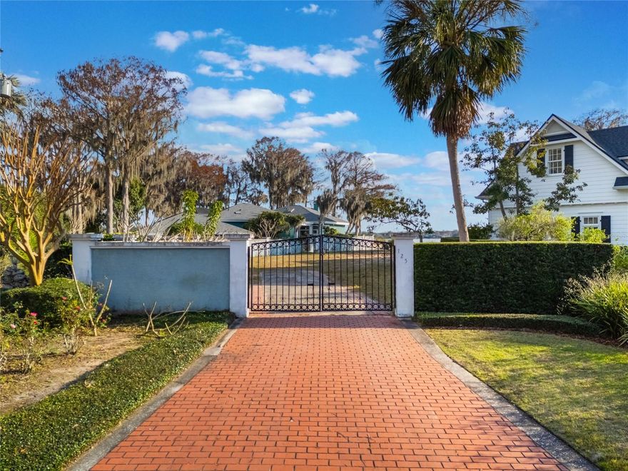 Once-in-a-lifetime opportunity to own over 1.5 acres with .5 acre high and dry with approximately 110 ft waterfront on the Whitecaps Circle peninsula on the north shore of Lake Maitland!  The property has southern exposure enjoying sunrise, sunsets and view of Dog Island. The lot includes front entrance gate, east side masonry wall,  seawall, boathouse and dock, and all are all sold as-is. Adjacent property on 127 Whitecaps Circle is also for sale. Purchasing both properties would give the new owner a very unique and stunning peninsula  on Lake Maitland on the famed Winter Park Chain of Lakes! Having water frontage on three sides provides complete panoramic views. The new owner could renovate the current home or build their dream home! See MLS# O620214