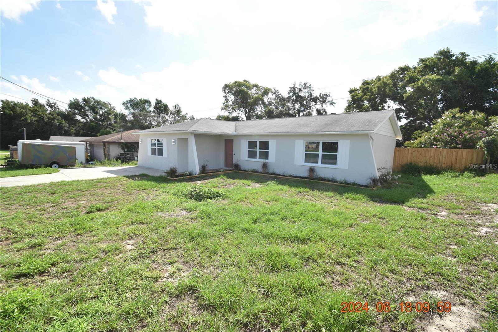 This fully 2024 renovated Spring Hill home features 3 bedrooms and 2 bathrooms, along with a stunning private pool. The home was professionally staged and will be delivered unfurnished—ready for your personal finishing touches. Step inside to discover a wide open floor plan with vaulted ceilings, gorgeous hardwood floors, and updated lighting throughout. The large living area flows seamlessly into a stylish kitchen, complete with a massive center island, breakfast bar, and an abundance of cabinet and counter space. Stainless steel appliances include a side-by-side refrigerator, glass-top range, microwave, and dishwasher. The master suite features a walk-in closet and an en suite bathroom that has been tastefully updated, along with a refreshed secondary bath. Enjoy the Florida lifestyle in your large screened and covered back lanai, or take a dip in the beautiful in-ground pool—perfect for both relaxation and entertaining. Additional features include ceiling fans, central heat and air, and washer/dryer hookups. Located just minutes from shopping, dining, parks, and the Weeki Wachee River. Easy access to US-19 makes commuting a breeze.