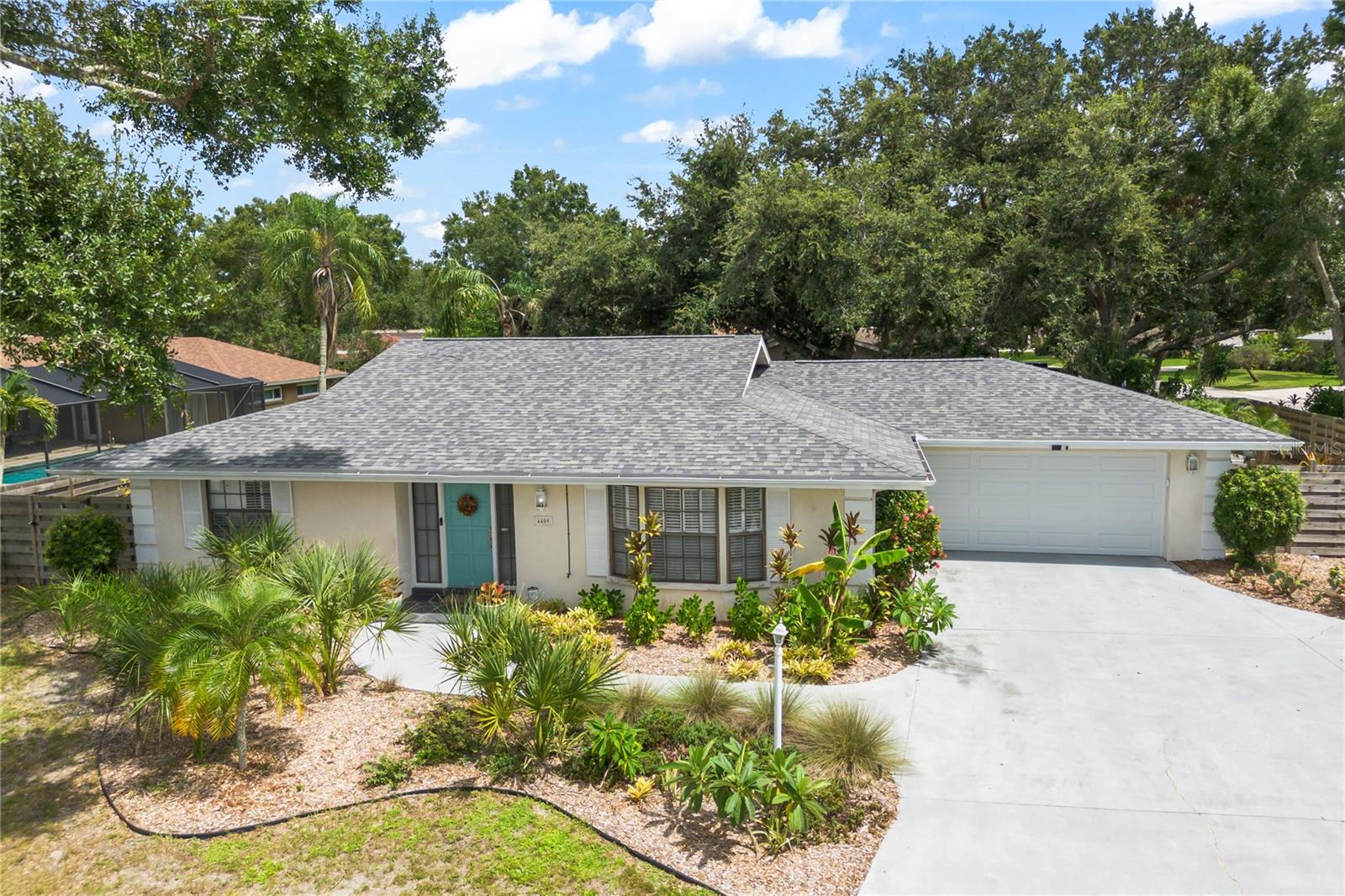 Corner lot single family home with newer roof (2023) and plumbing! Welcome to Bent Tree Village! This beautifully maintained 3-bedroom, 2-bathroom plus florida room home sits on a desirable corner lot in one of Sarasota's most sought-after golf course communities. When you enter the residence, you cannot help but notice the abundance of natural light that flows into the foyer. Here you will find a formal living room and dining area. As you proceed through the kitchen you will be surprised to find another living area which leads to an airconditioned florida room that overlooks the backyard. Continue down the hallway to view the spacious bedrooms and the two bathrooms this home offers. Live the true Florida lifestyle and store your kayaks, paddleboards, golf carts, and any outdoor toys in the large 2-car garage.
Outside, enjoy mature landscaping in the fenced yard that provides both charm and privacy. Located within an A-rated school district and near I75, you can combine everyday convenience with a community feel. This home has been meticulously maintained and features a newer roof, plumbing, outlets, water heater, and fence. It truly is a move in ready space!